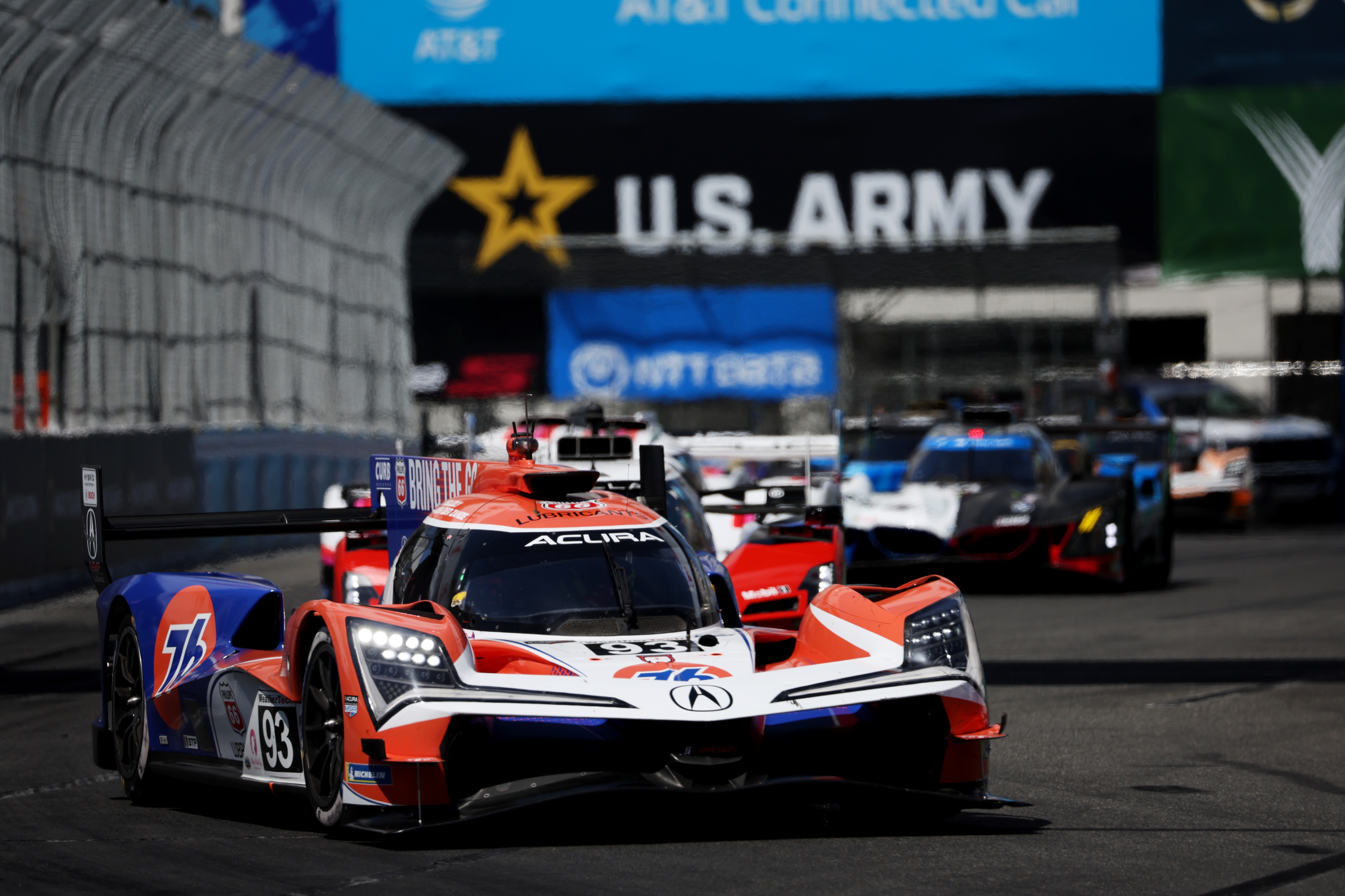 The Acura Meyer Shank Racing GTP (93) car hustles around...