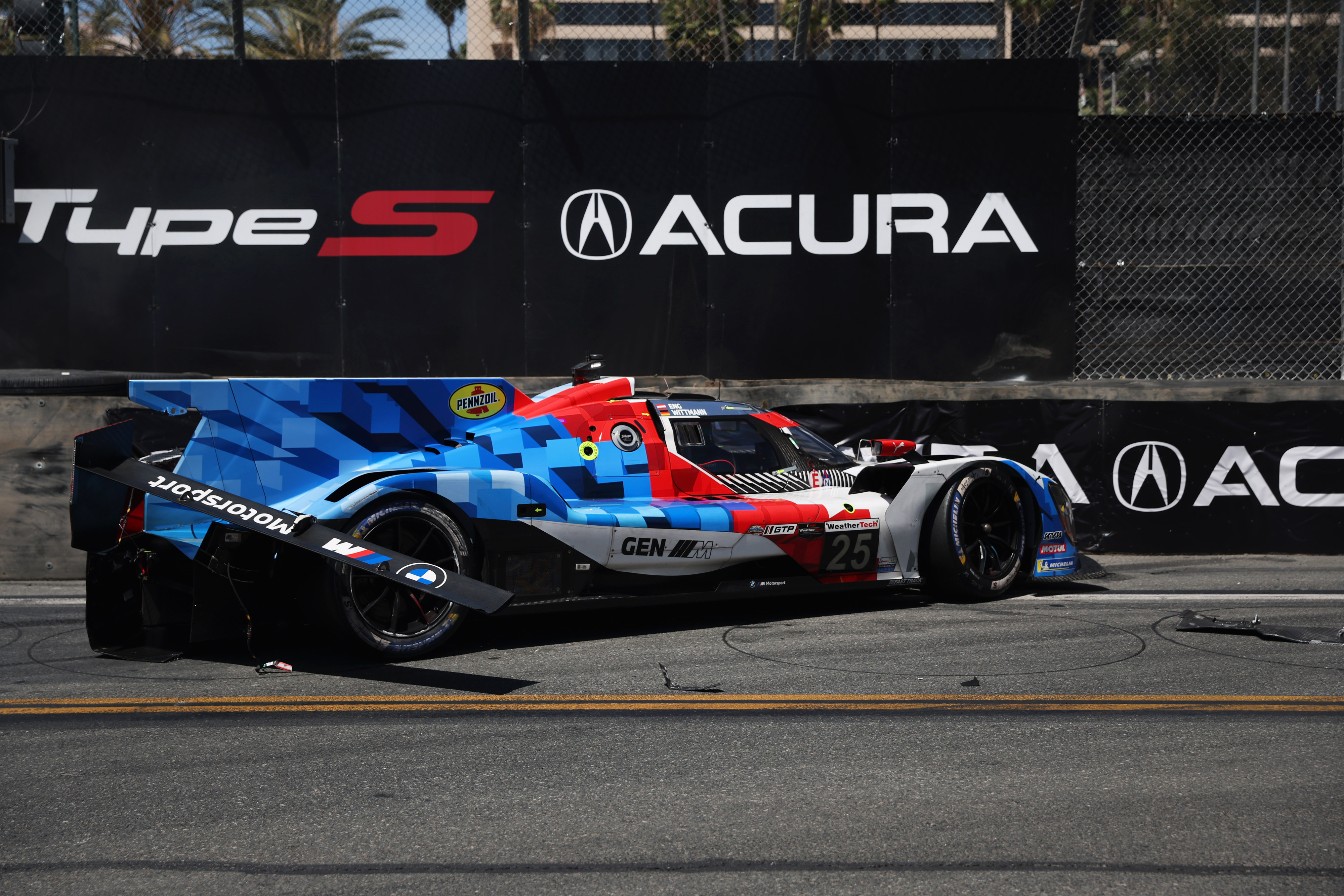 The BMW M Team WRT GTP car (25) rests against...