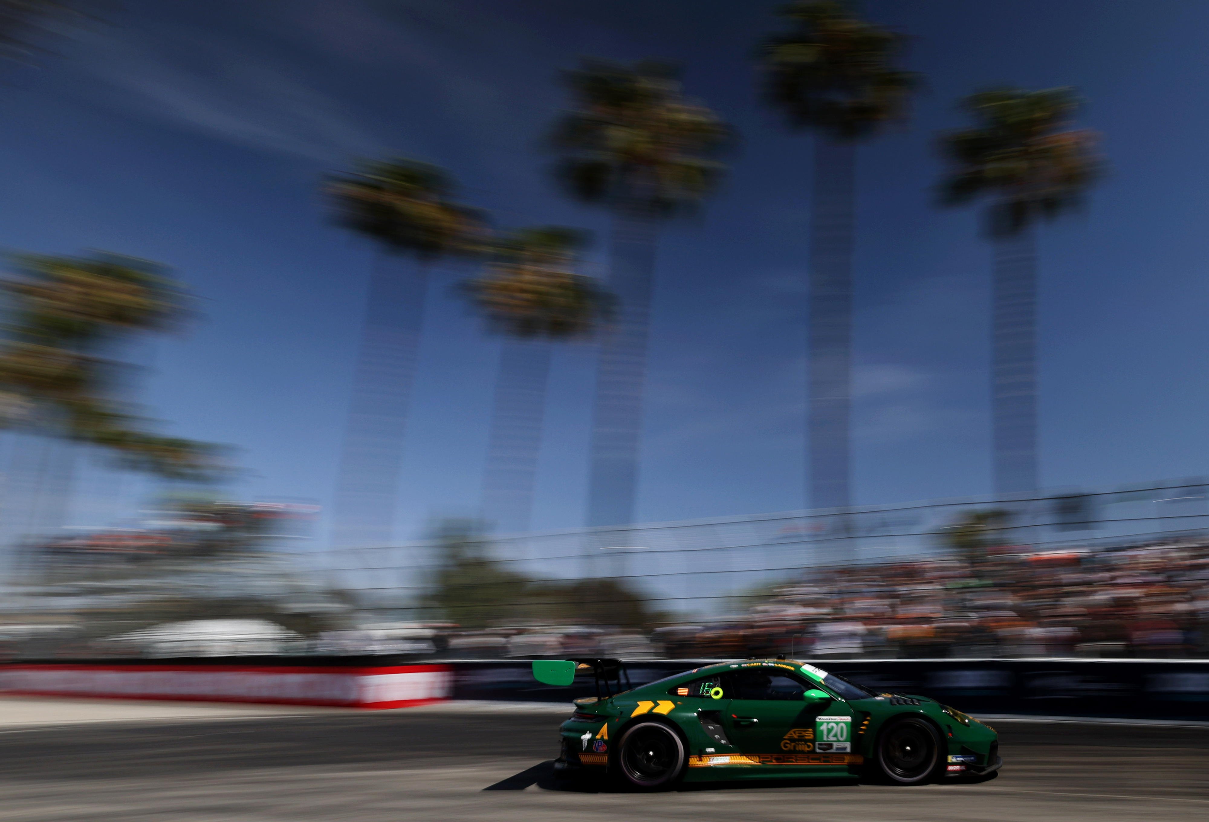 The Wright Motorsports GTD car (120) races out of the...