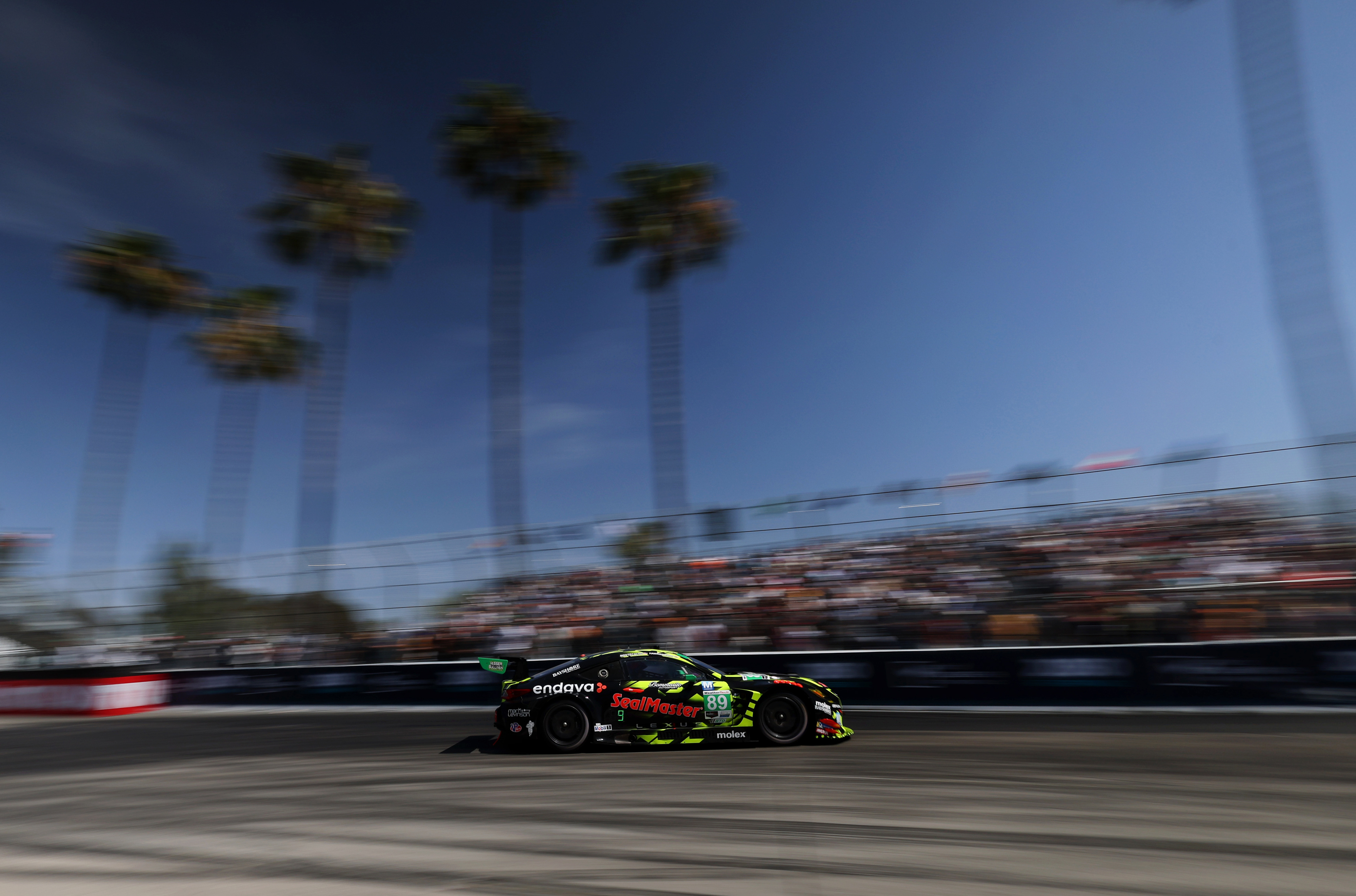 The Vasser Sullivan Racing GTD car (89) speeds out of...