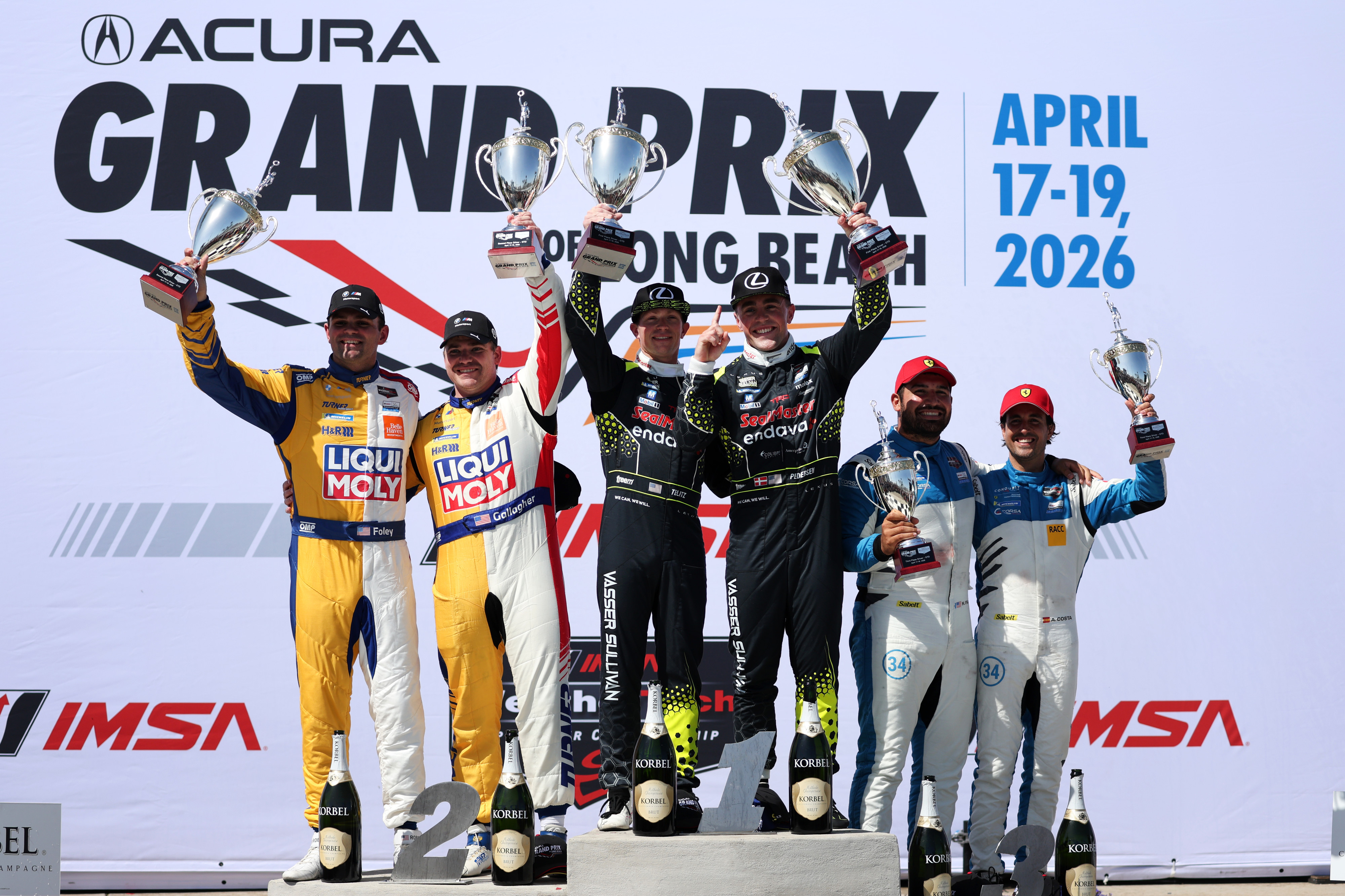 IMSA GTD winners Aaron Telitz, center left, and Benjamin Pedersen,...