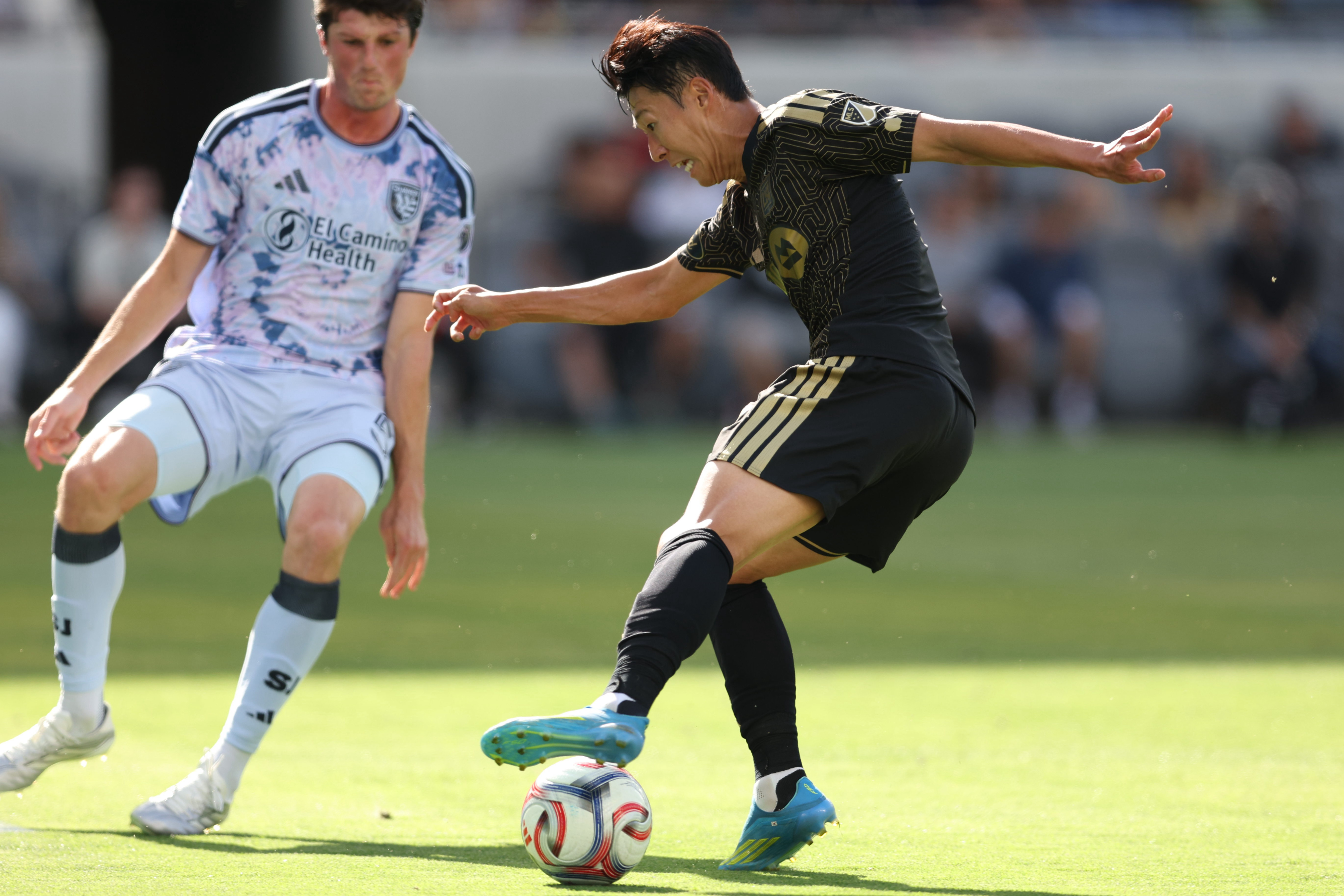 LAFC forward Son Heung-Min controls the ball defended by San...