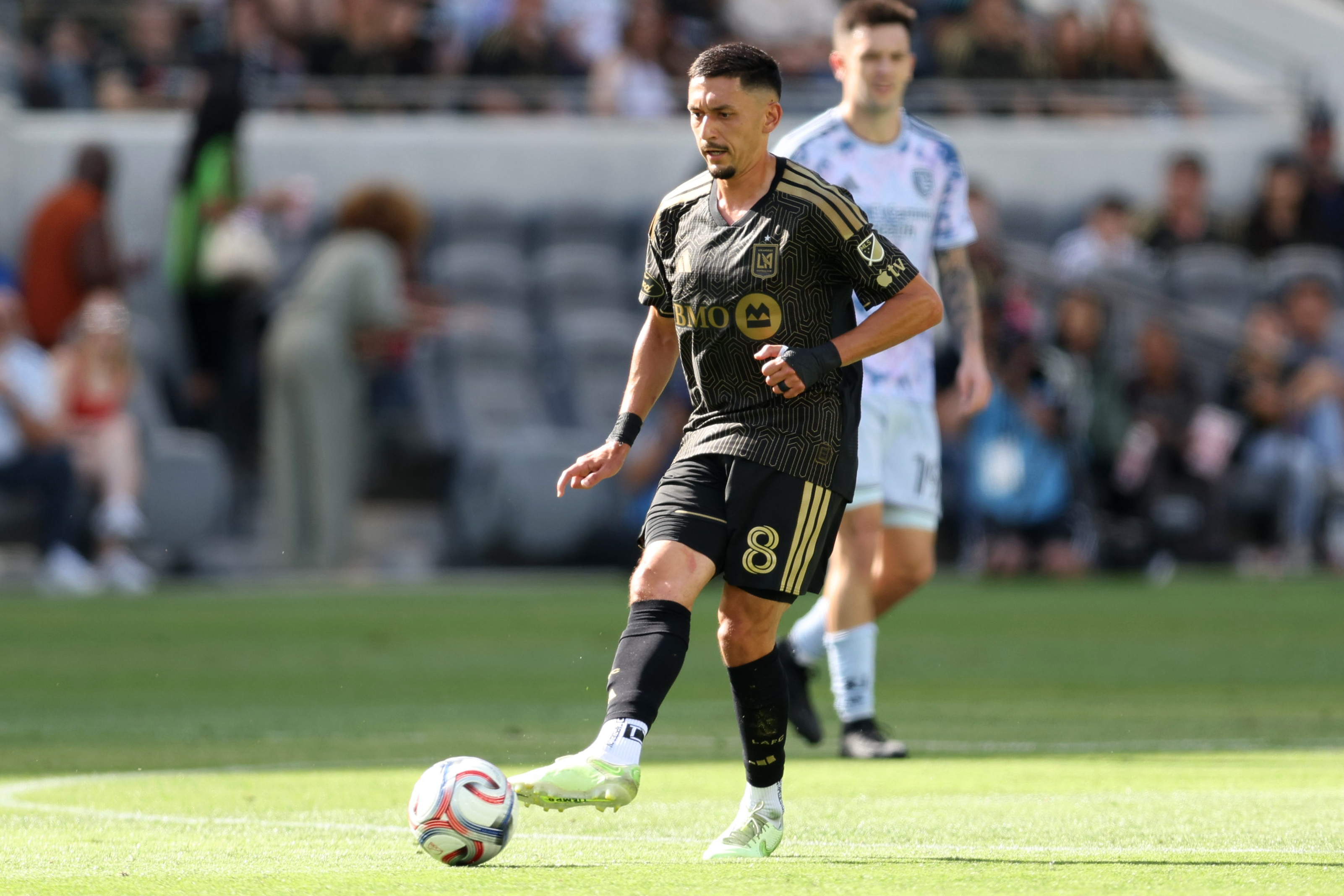 LAFC midfielder Mark Delgado kicks the ball against the San...