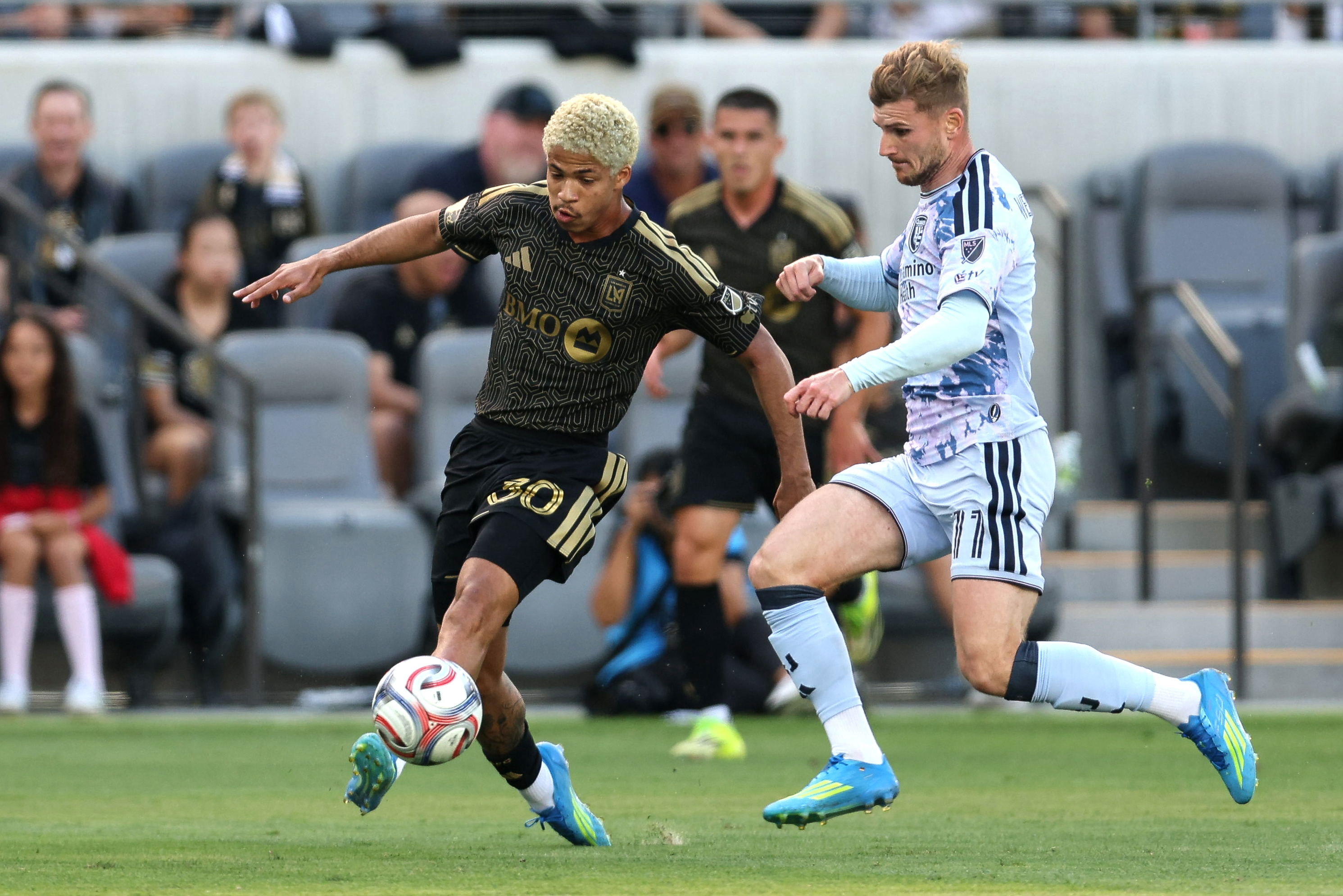 LAFC forward David MartÃ­nez (30) controls the ball defended by...