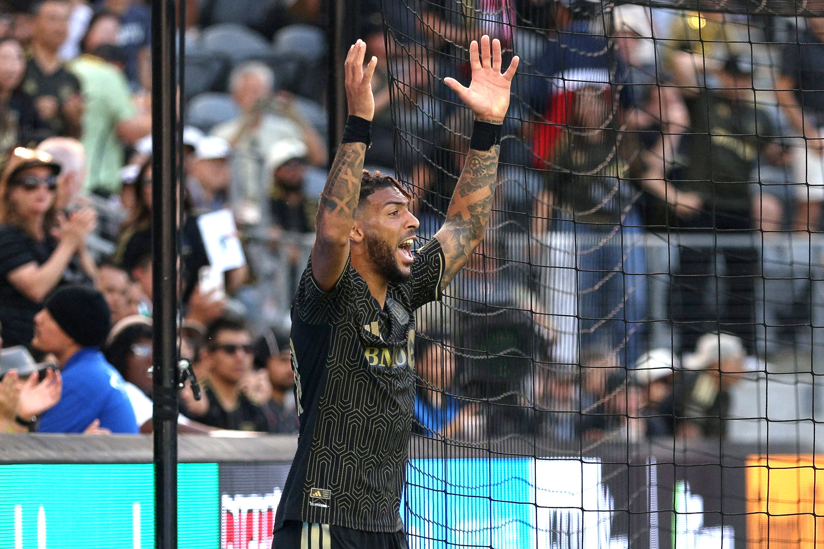 A frustrated LAFC forward Denis Bouanga reacts after not getting...
