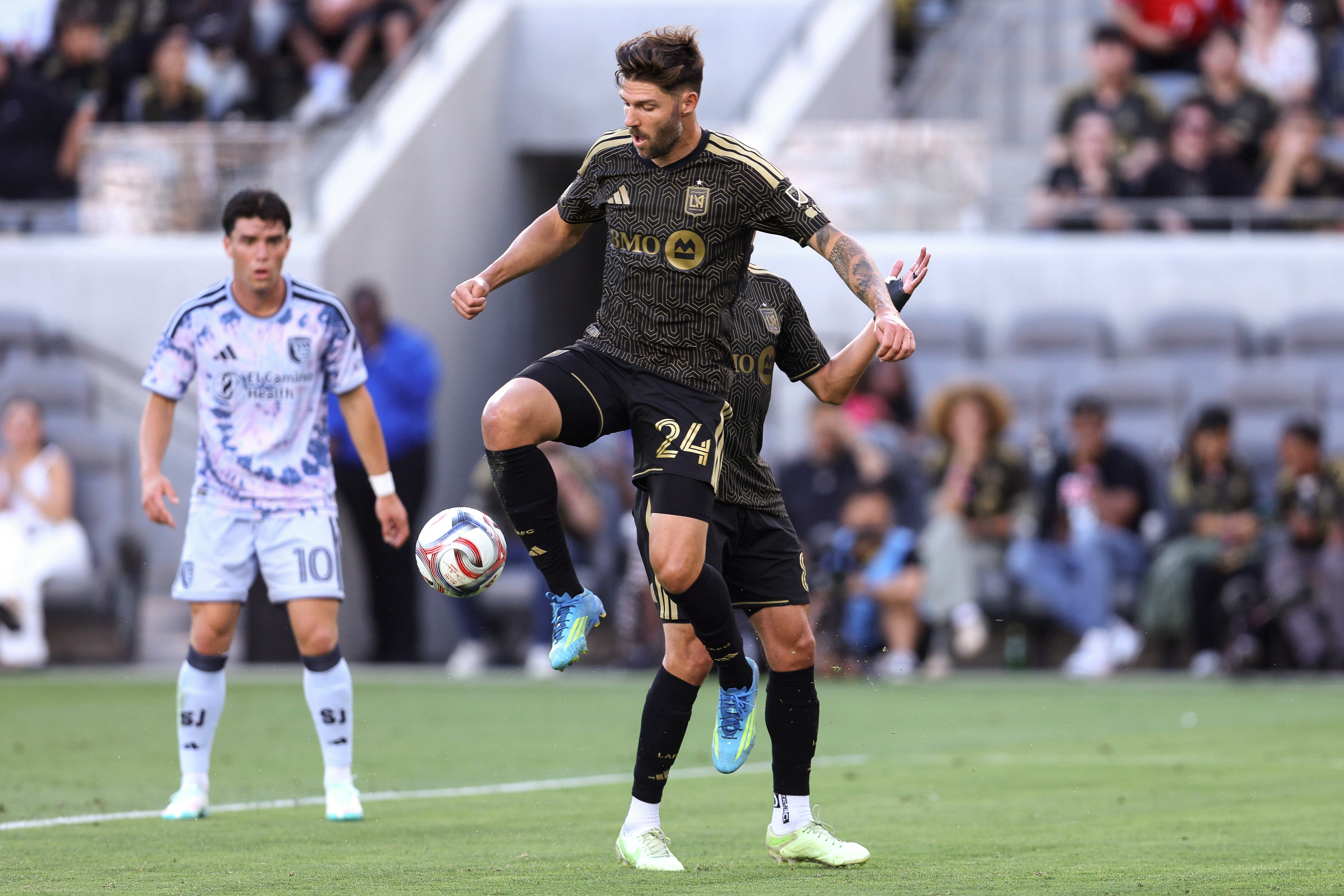 LAFC defender Ryan Hollingshead recovers the ball against the San...