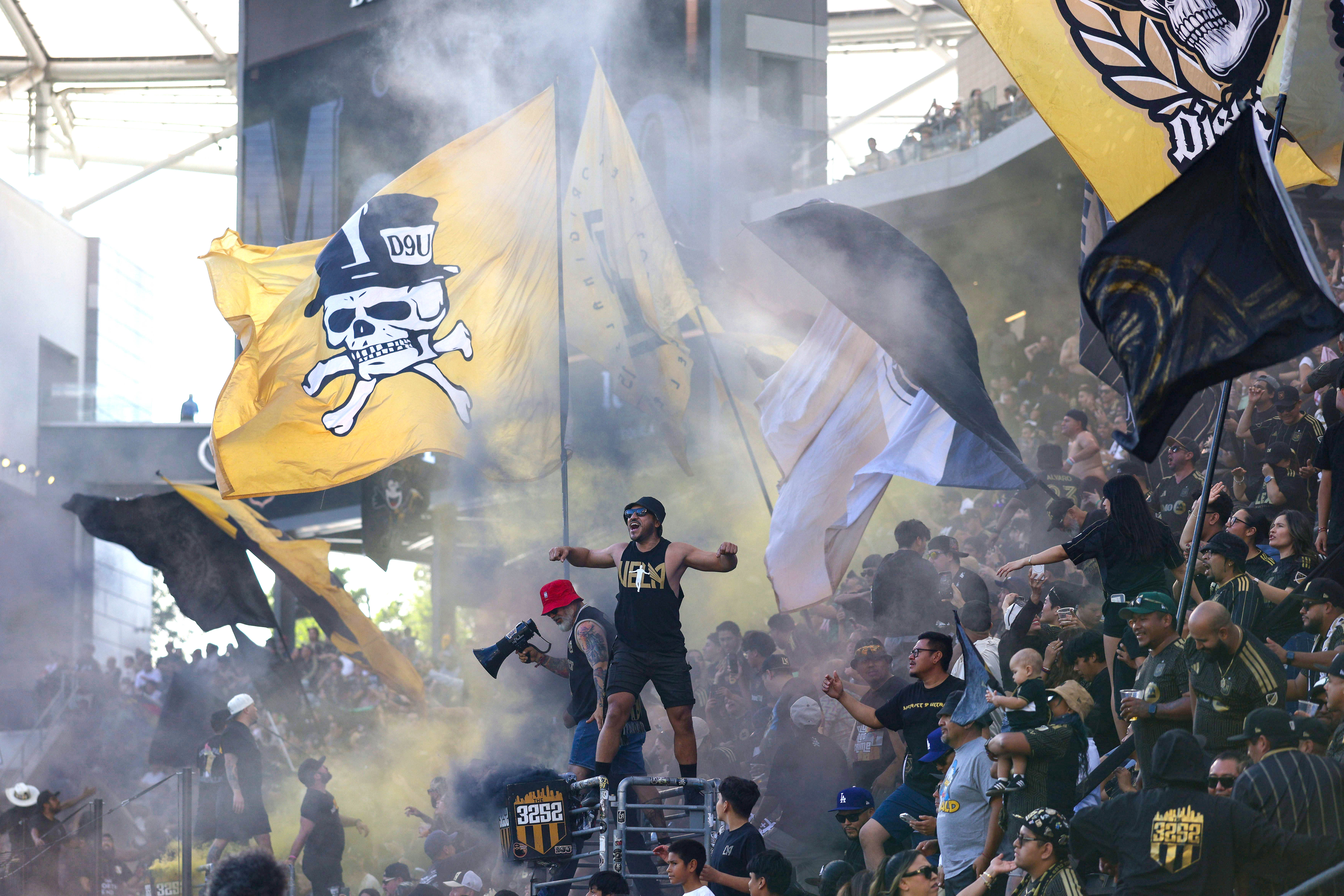 LAFC supporters celebrate after an own-goal by the San Jose...
