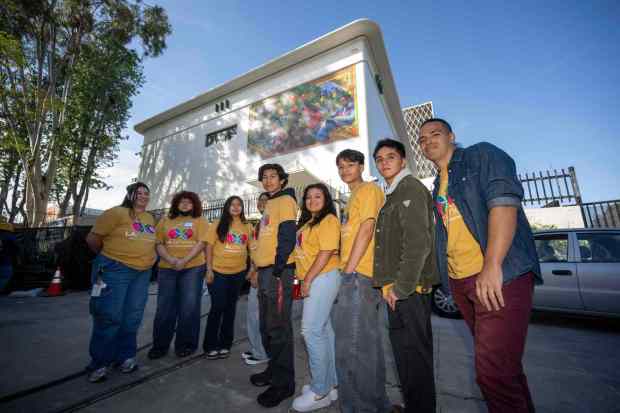 Youth artists with the mural they helped create on the outside of the UCLA James Lawson Jr. Worker Justice Center in Los Angeles on Thursday, April 23, 2026. (Photo by Hans Gutknecht, Los Angeles Daily News/SCNG)
