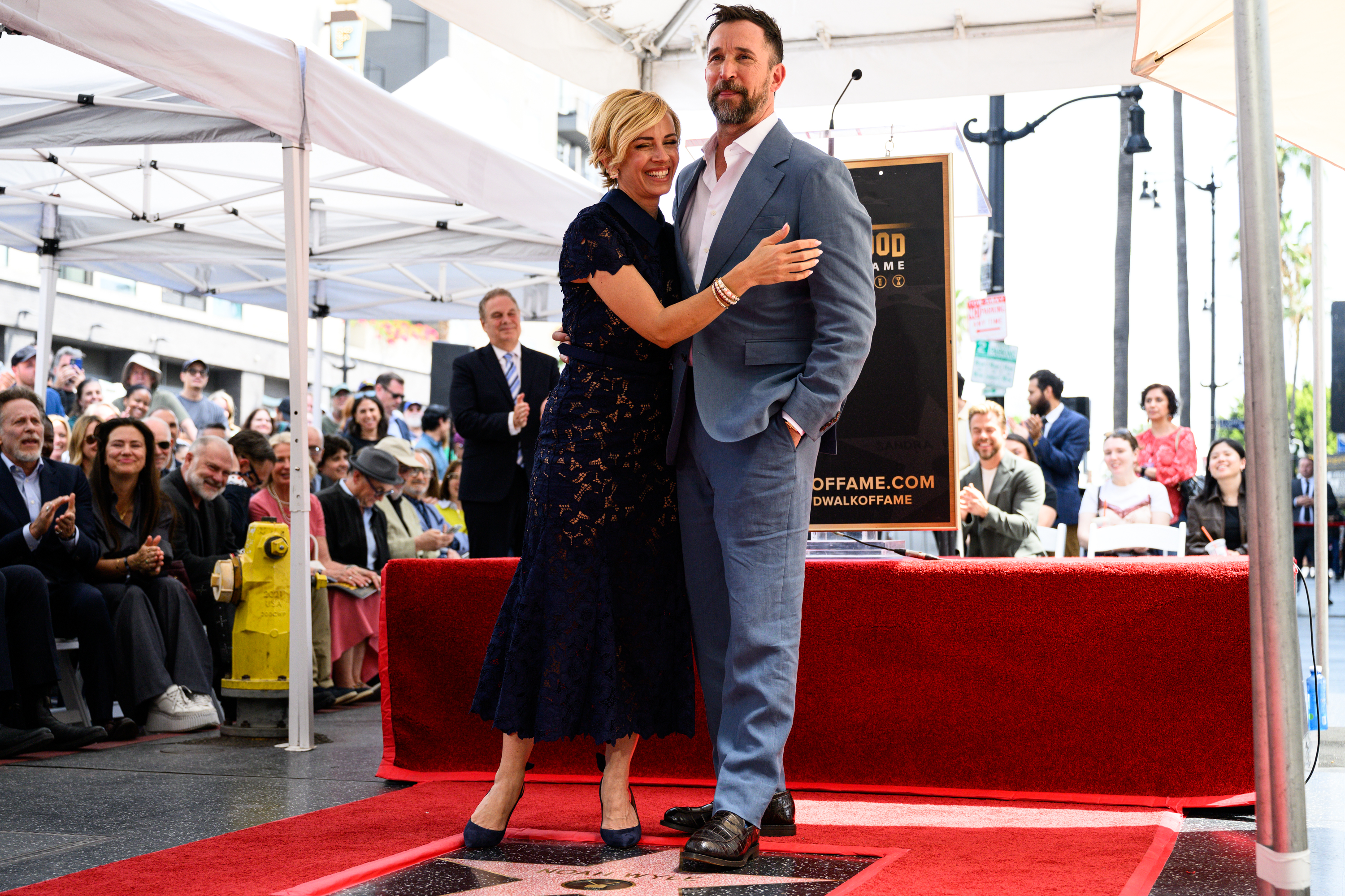 Noah Wyle and his wife Sara Wyle pose with his...