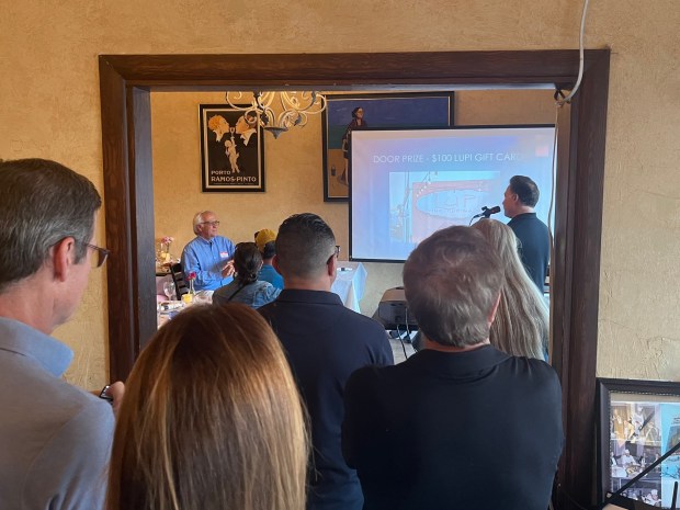 With all the tables occupied, people attending the Bird Rock Community Council meeting April 7 spilled into another room at Lupi Vino Cucina Bar to hear community updates. (Noah Lyons)