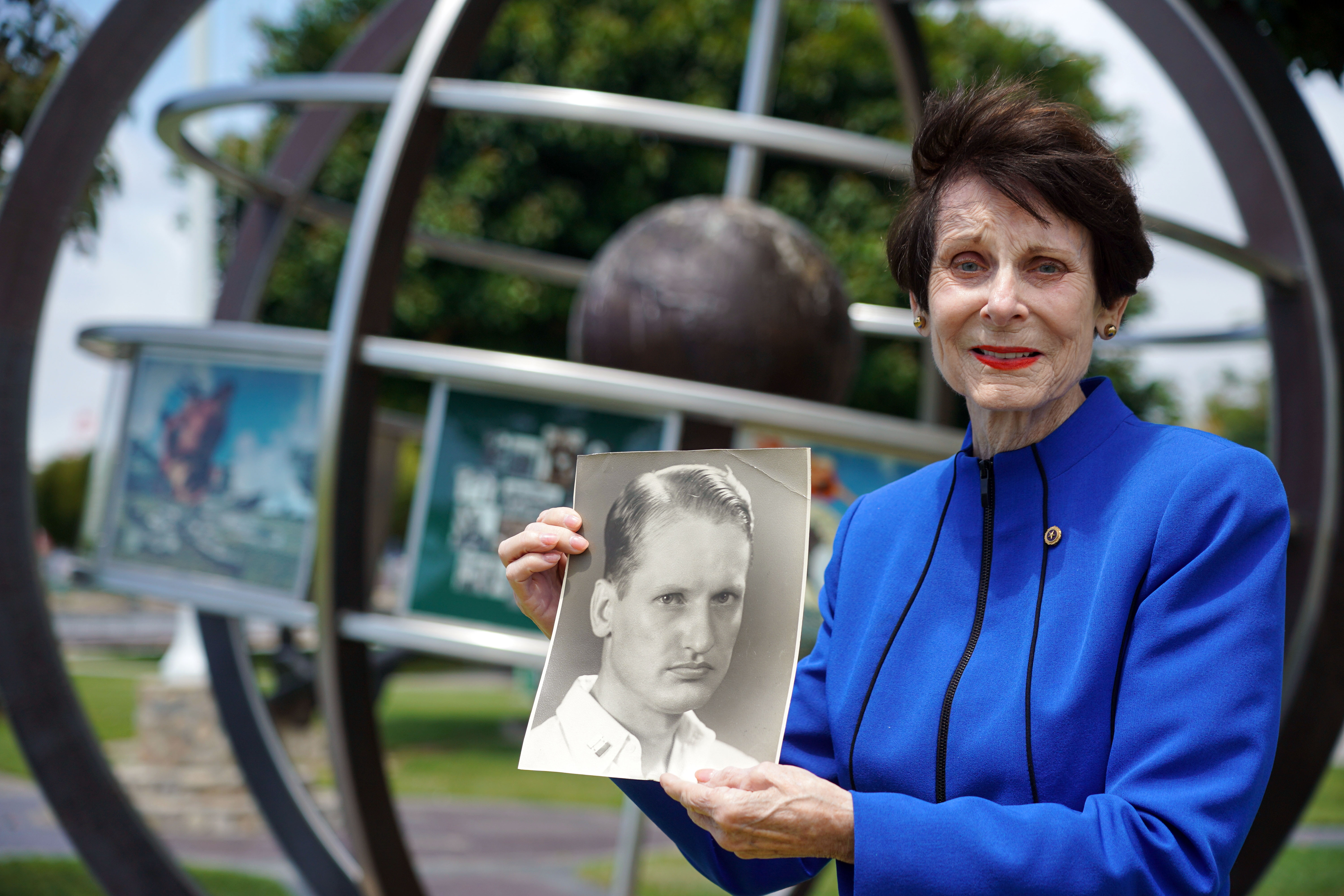 Diane Jacobus holds a photo of her late father, Lt....