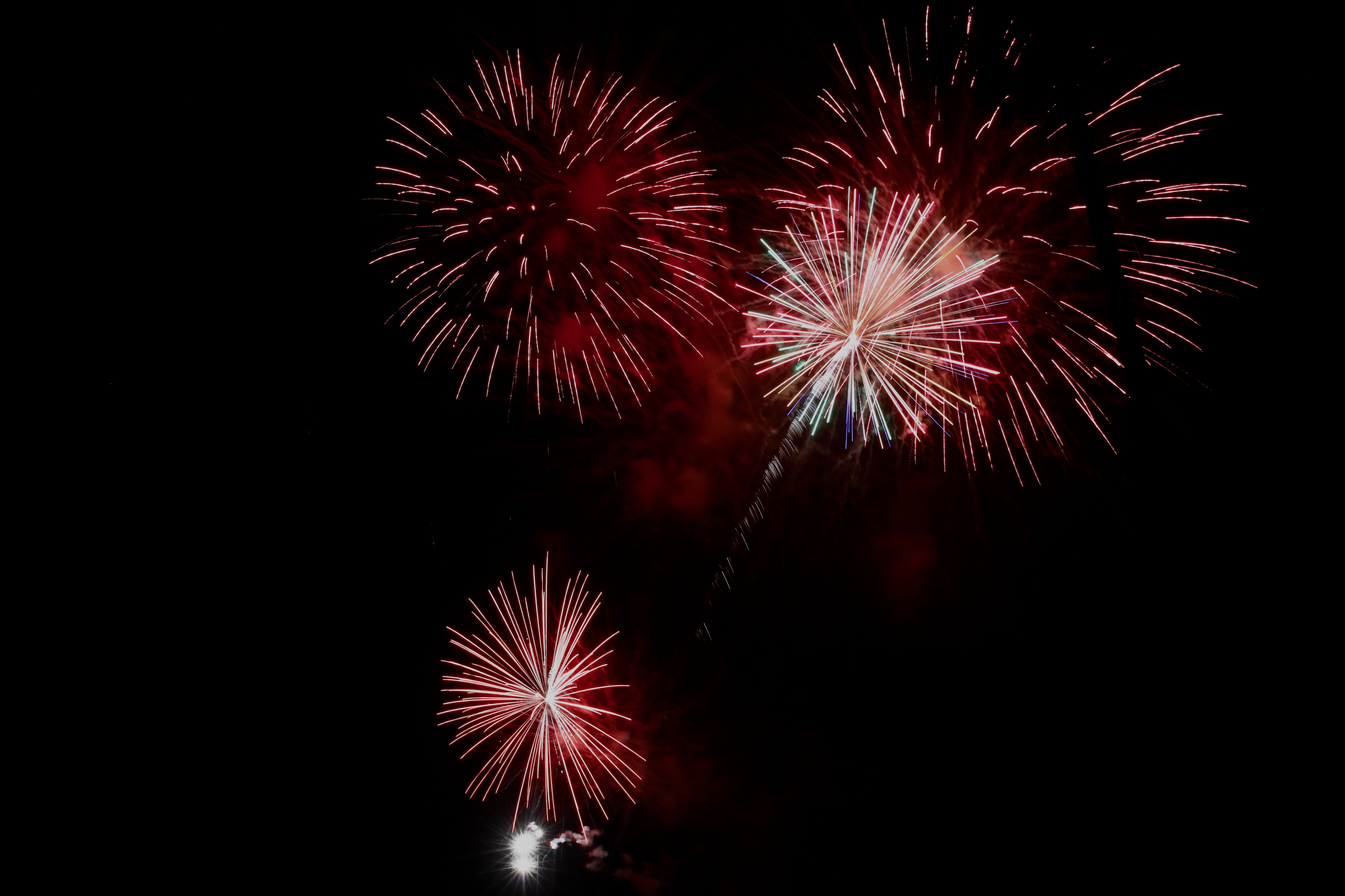 Fireworks light the sky over Alamitos Bay in Long Beach...