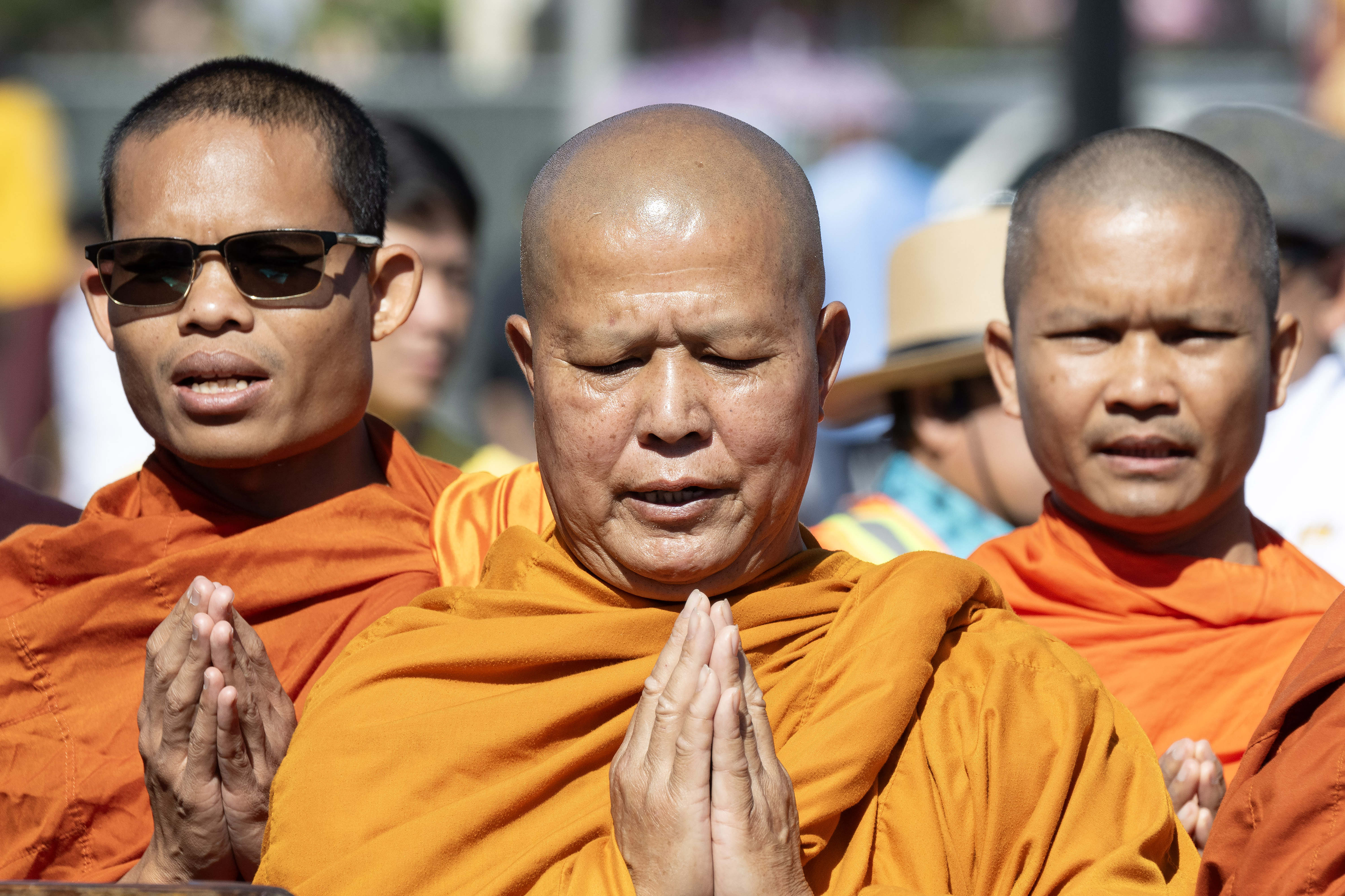 Buddhist monks lead a prayer during the opening ceremony of...