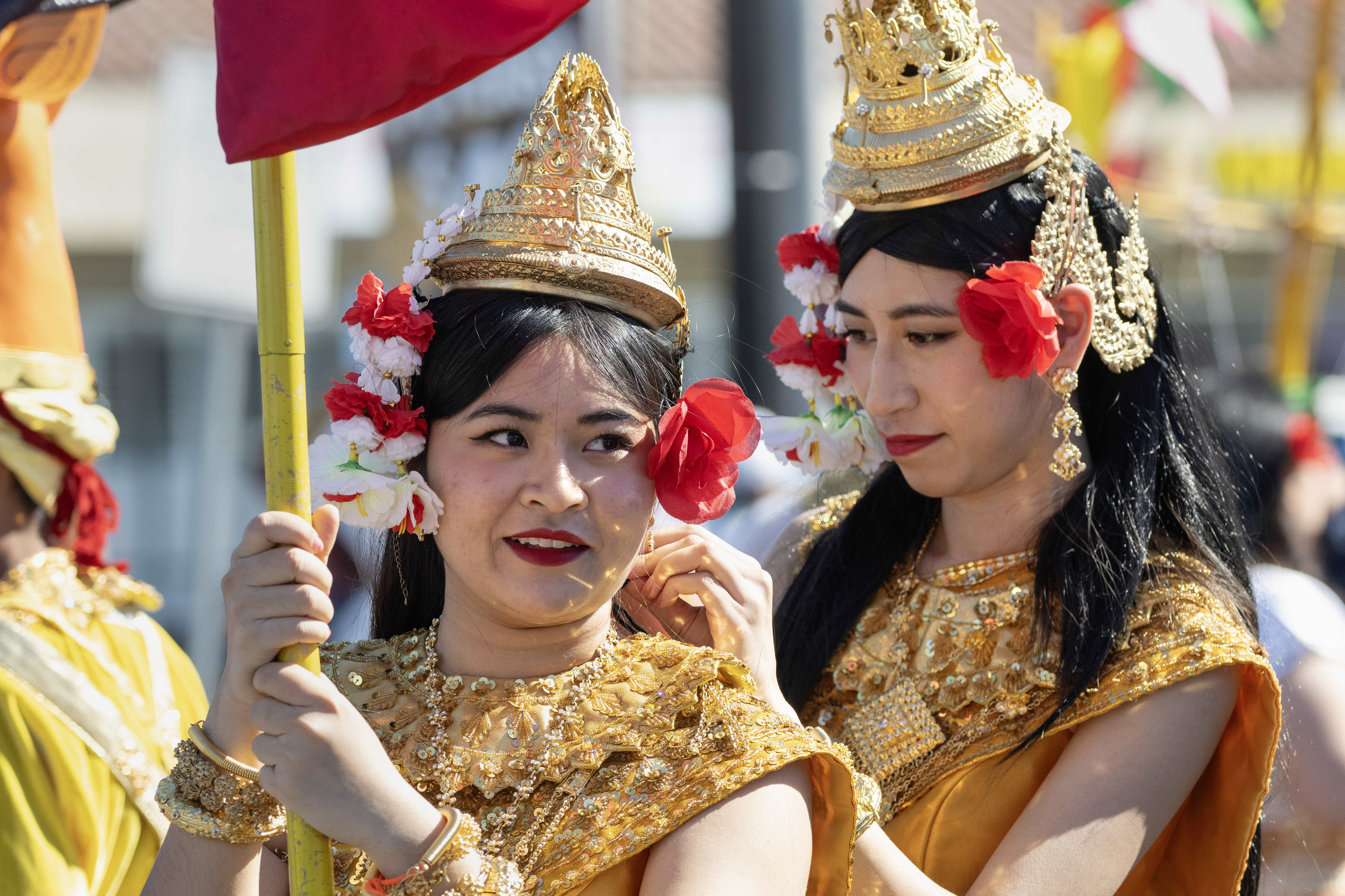 From right, Richenny Bovannak helps her sister Richtevy Bovannak with...