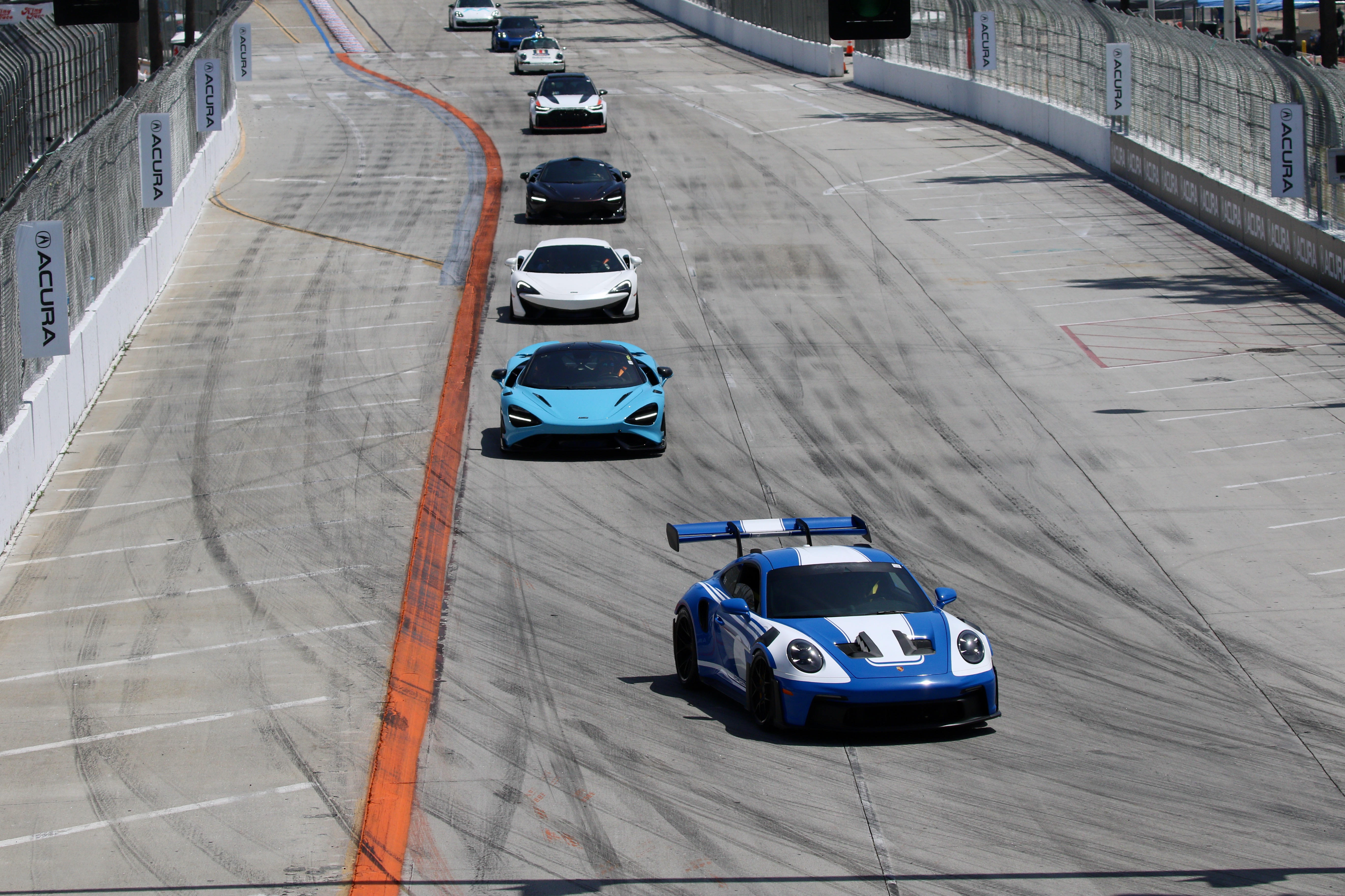Exotic cars ride down Shoreline Drive in the Mornings CARnival...