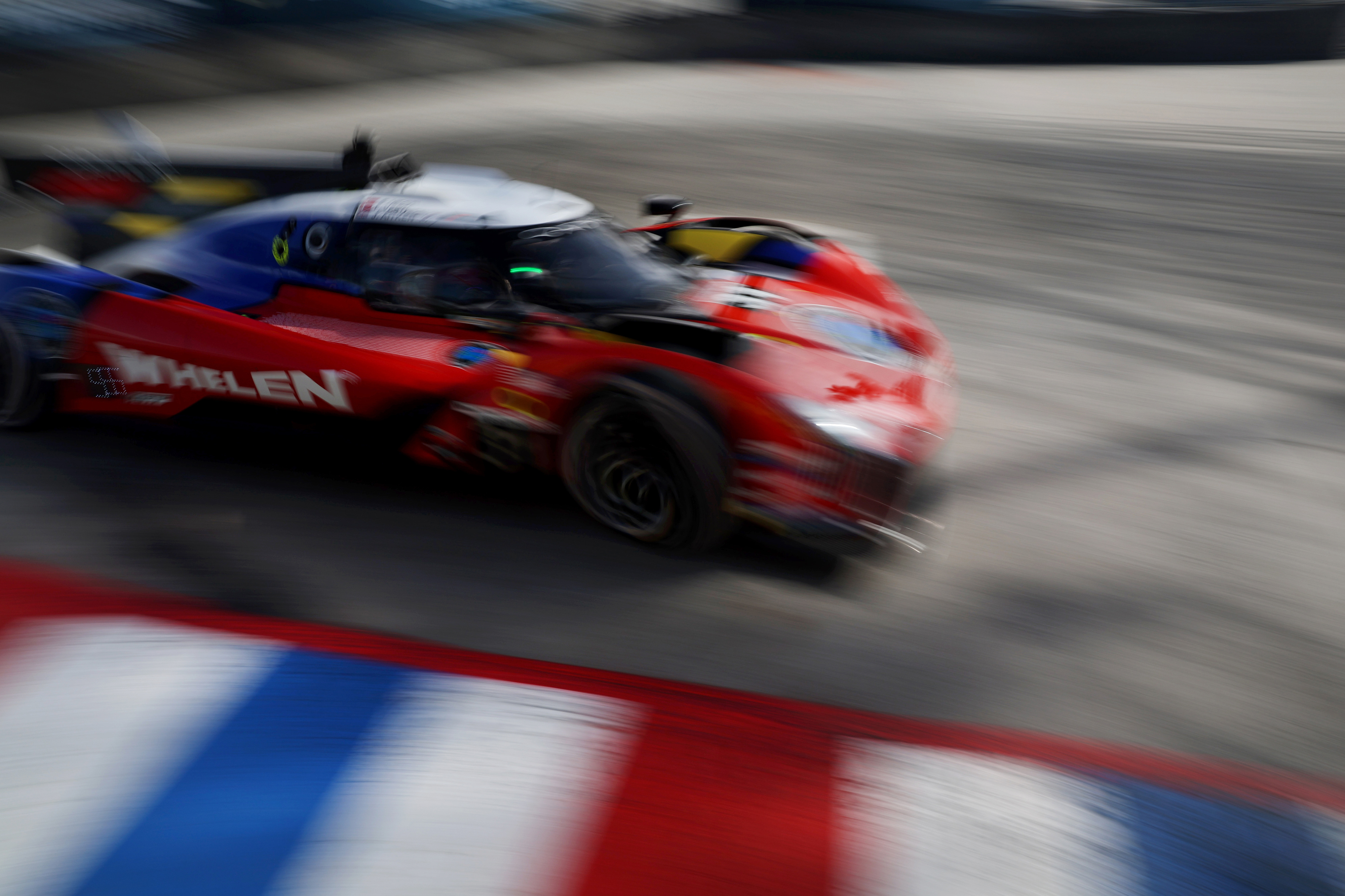 The Cadillac Whelen GTP car races around the hairpin in...