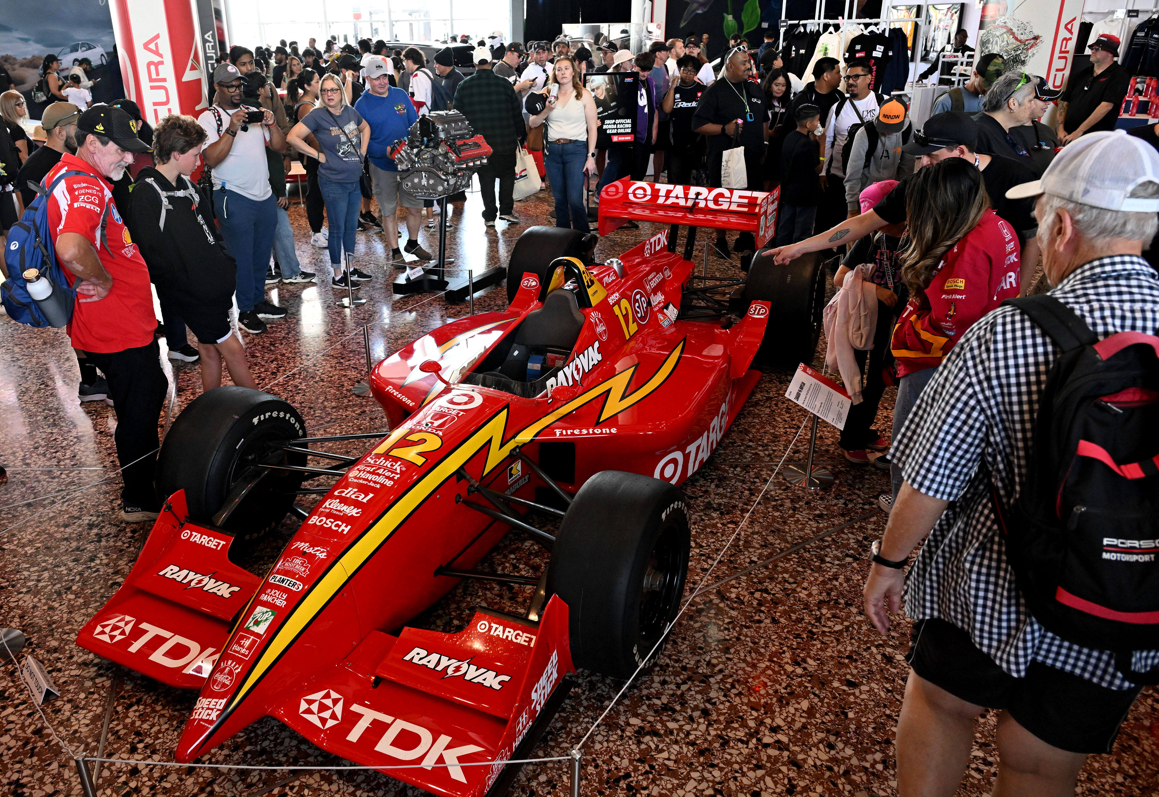 Race fans check out the Zanardi 96 Indycar vehicle on...