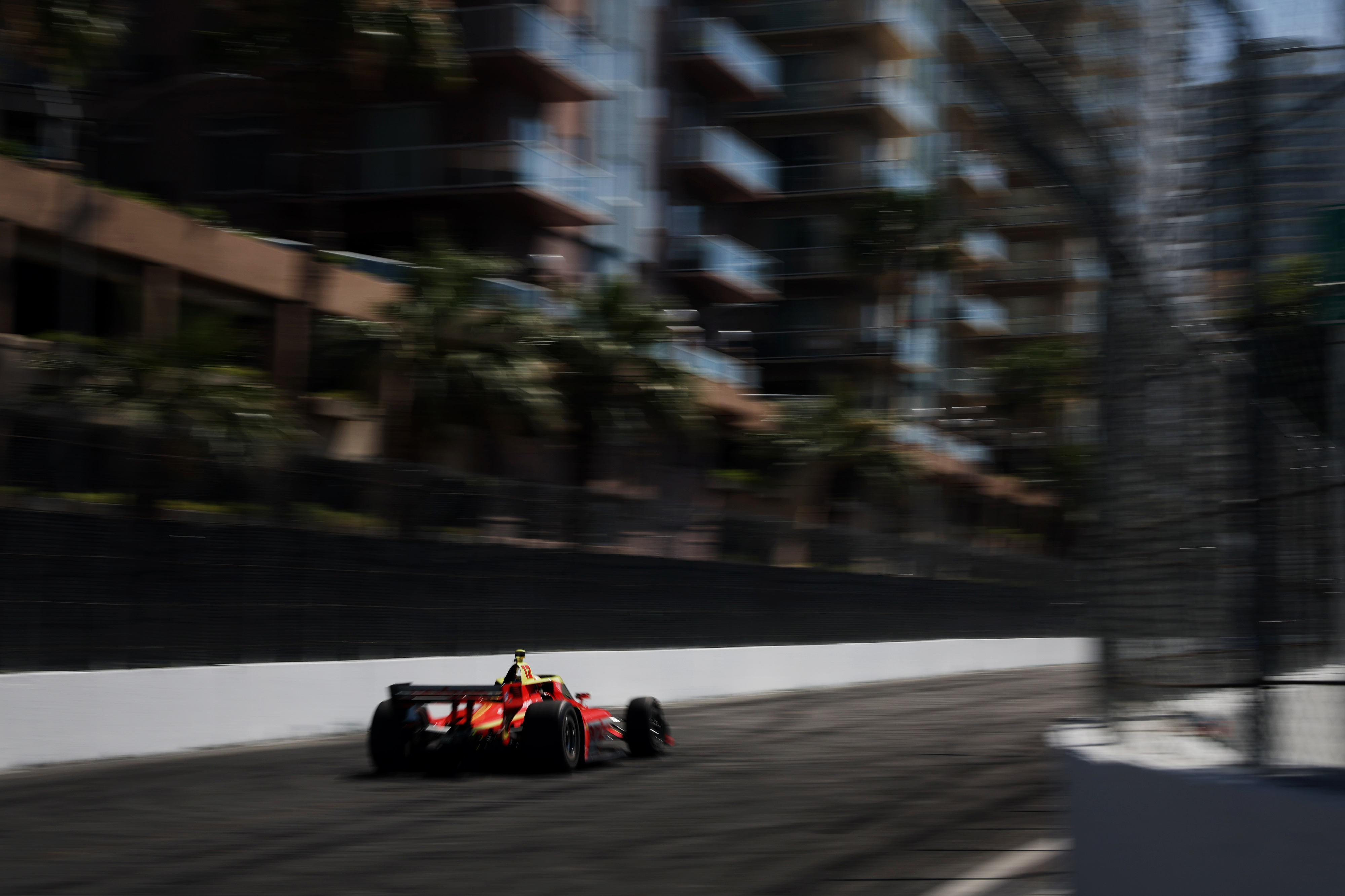 Indycar driver David Malukas speeds down the back stretch in...