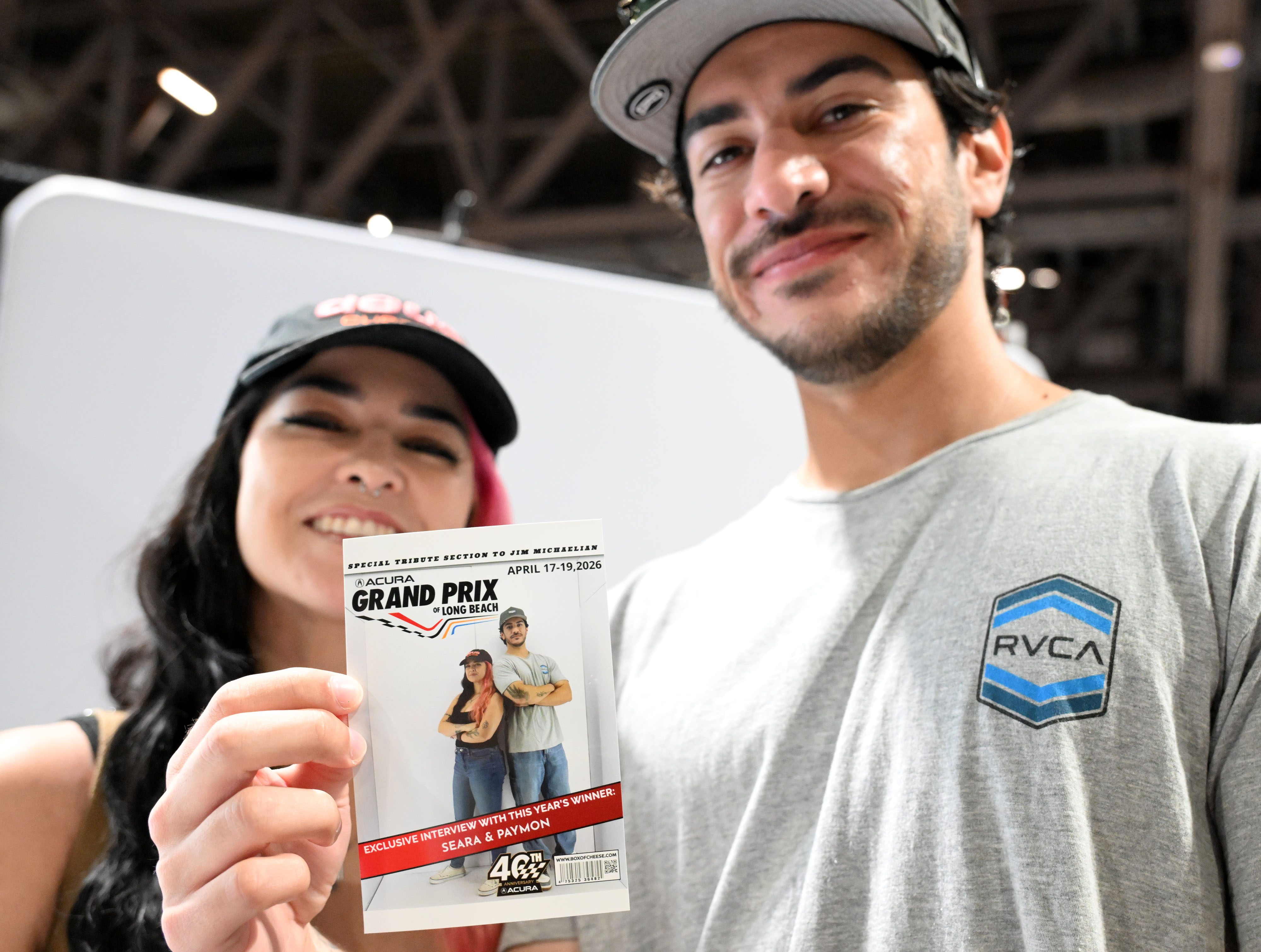 Seara and Paymon pose with their courtesy Grand Prix magazine...