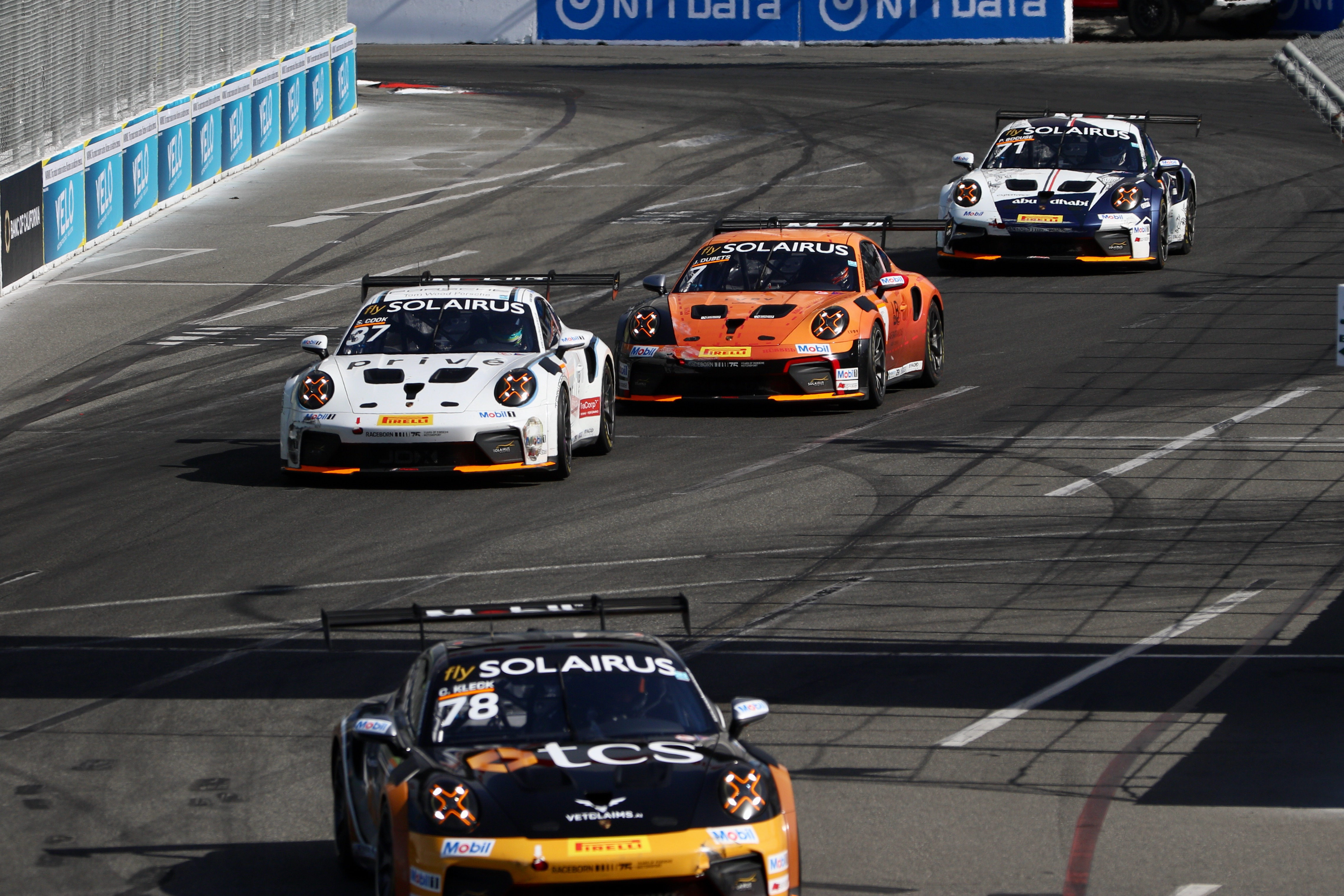 Identical Porsche 911 GT3 cars compete in the Porsche Carrera...