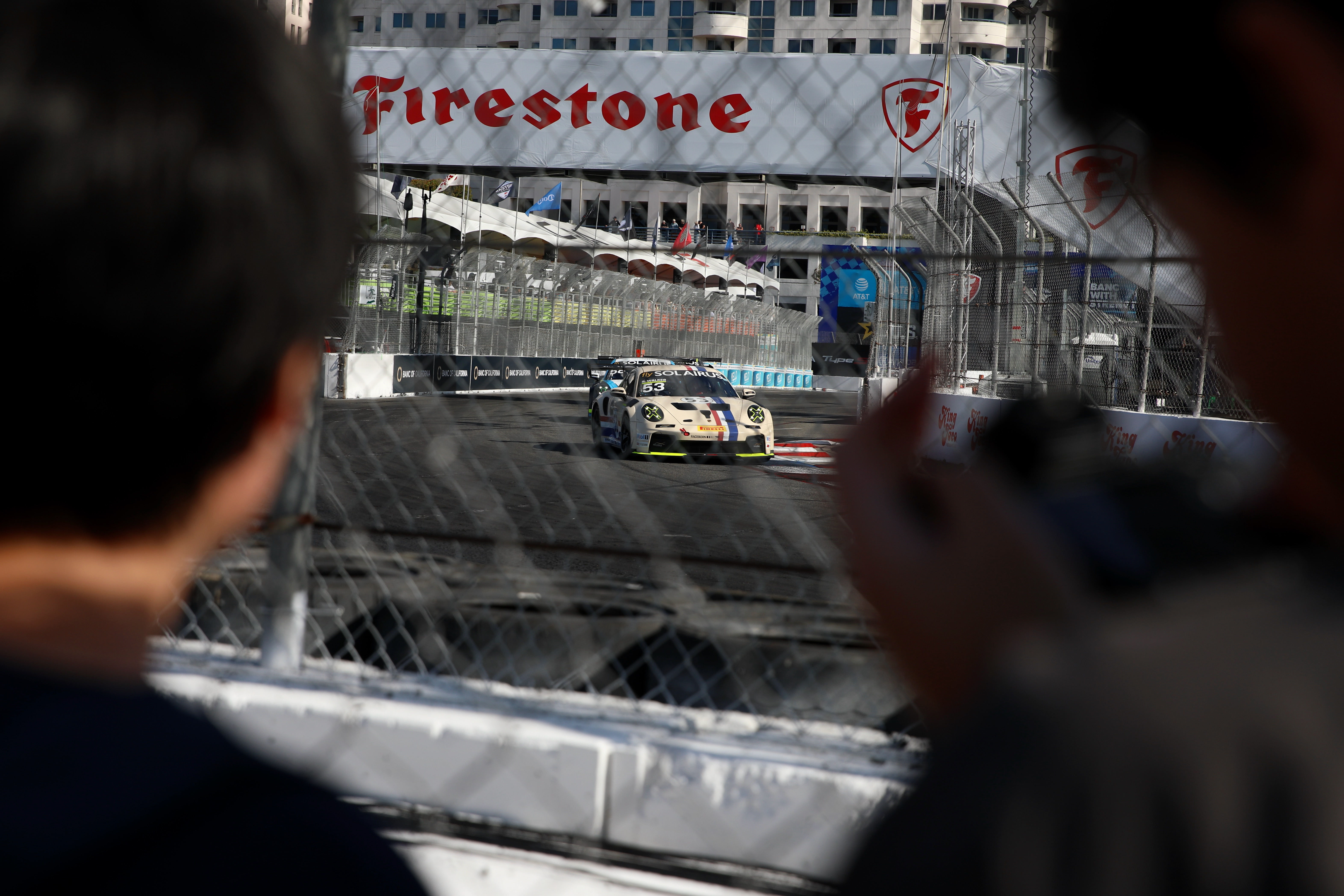Spectators get close to the track for the Porsche Carrera...