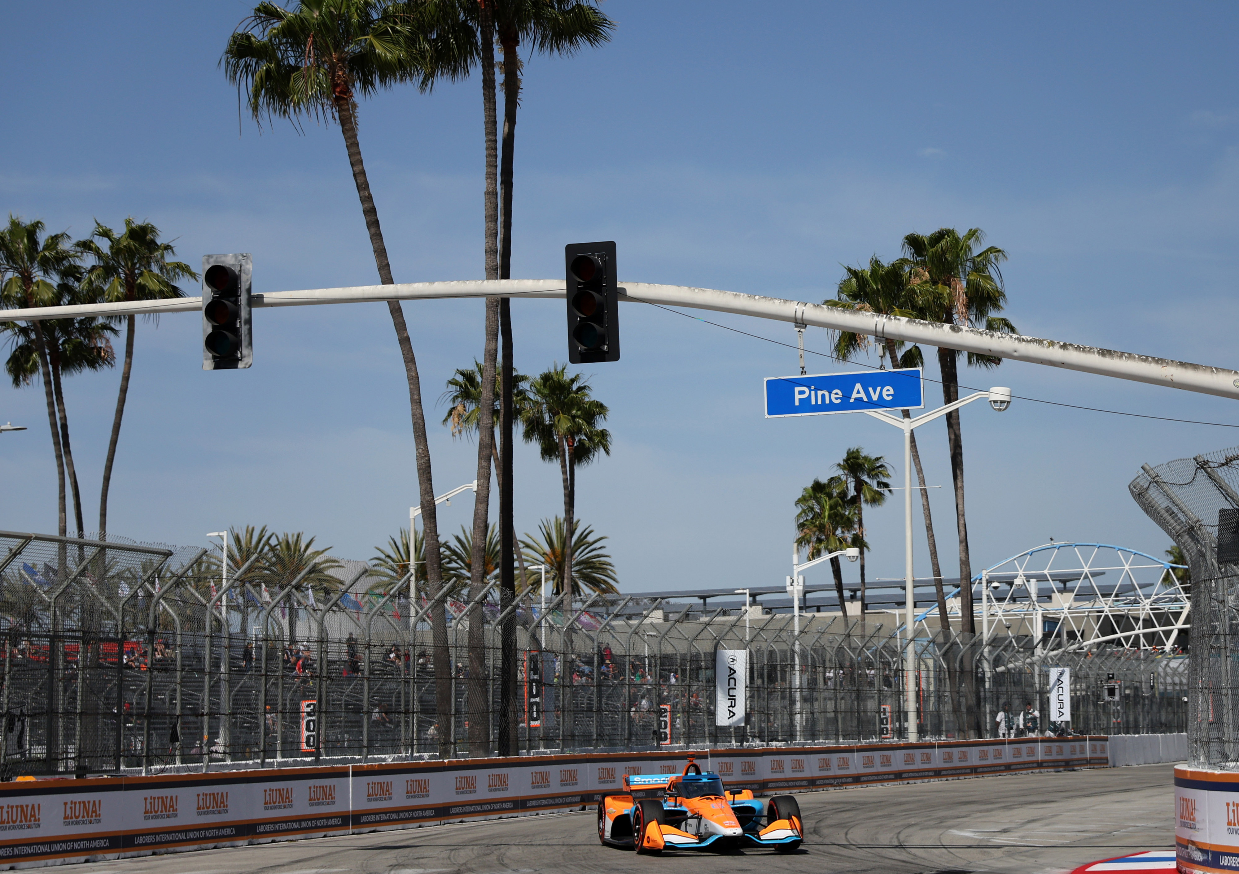Indycar driver Nolan Siegel warms up on track before the...
