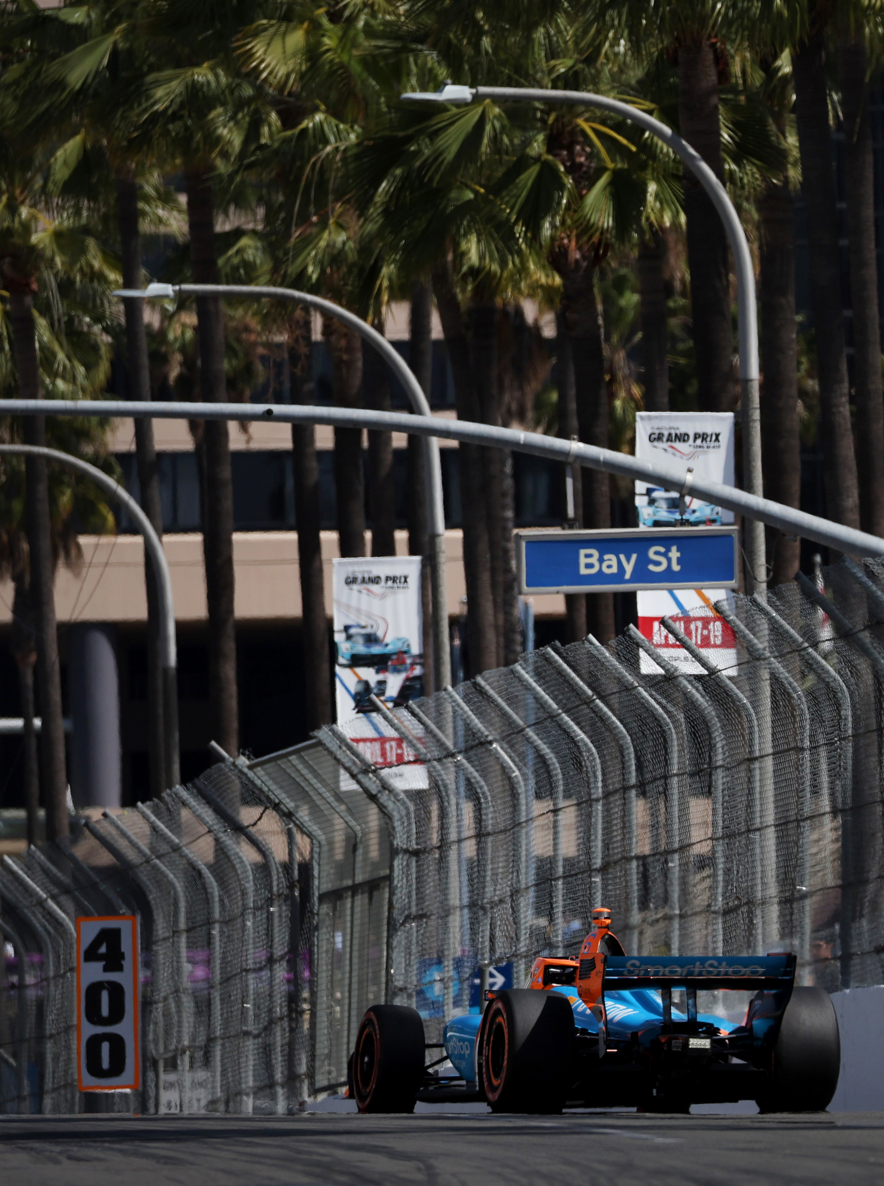 Indycar driver Nolan Siegel warms up on track before the...