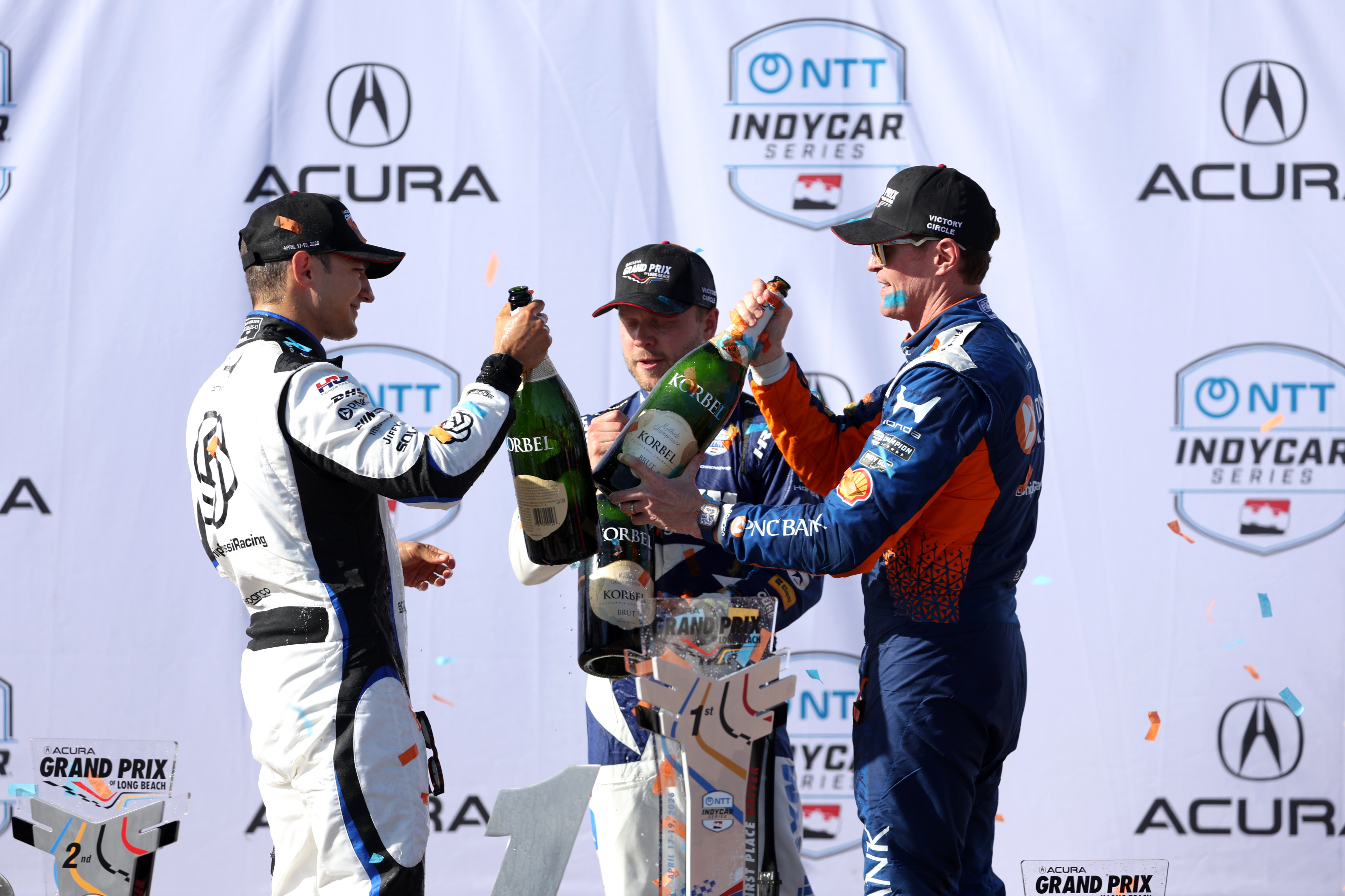 Winning Indycar driver Alex Palou, celebrates with second place finisher...