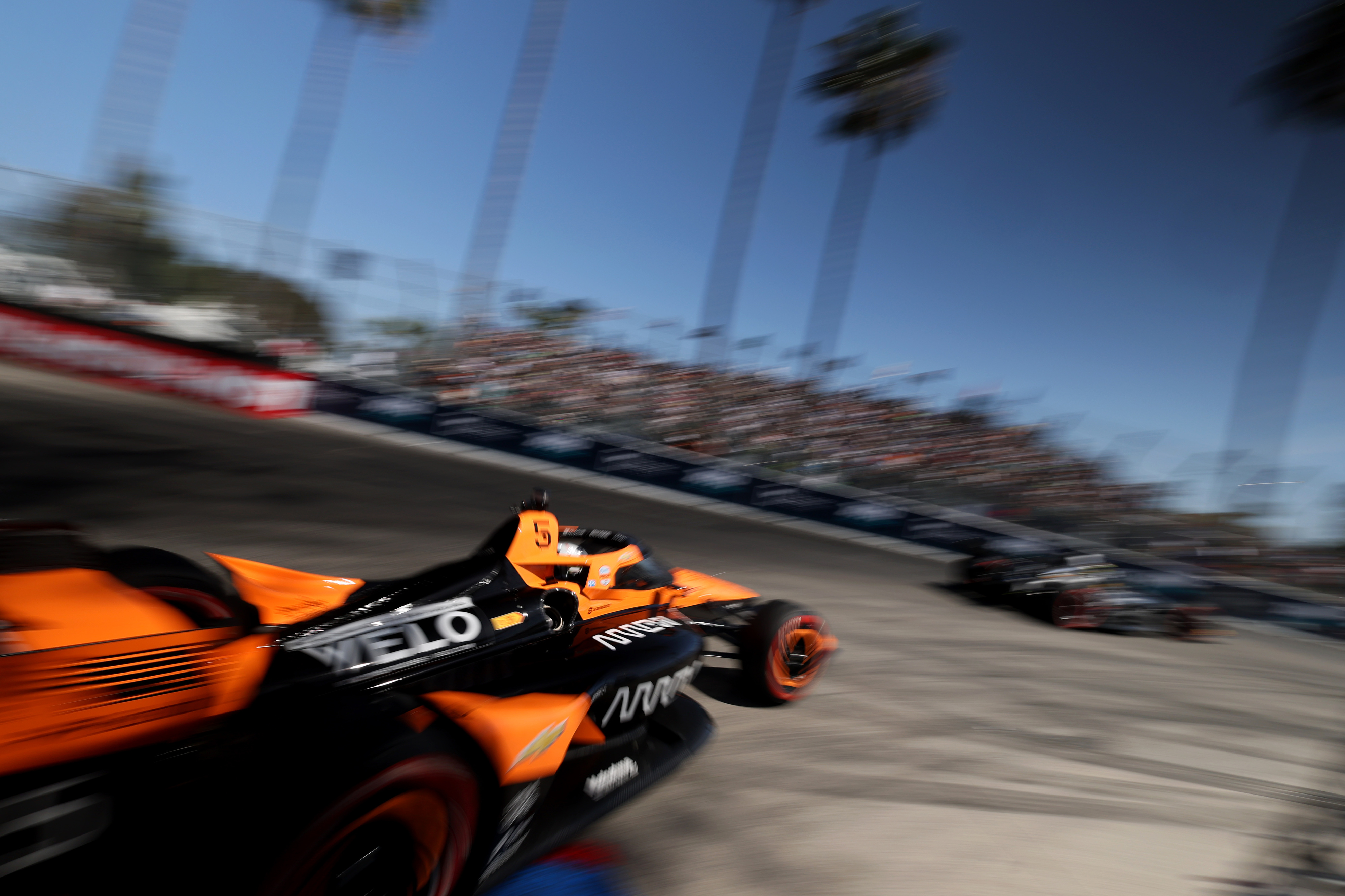 Indycar driver Pato OâWard races, left, races out of turn...