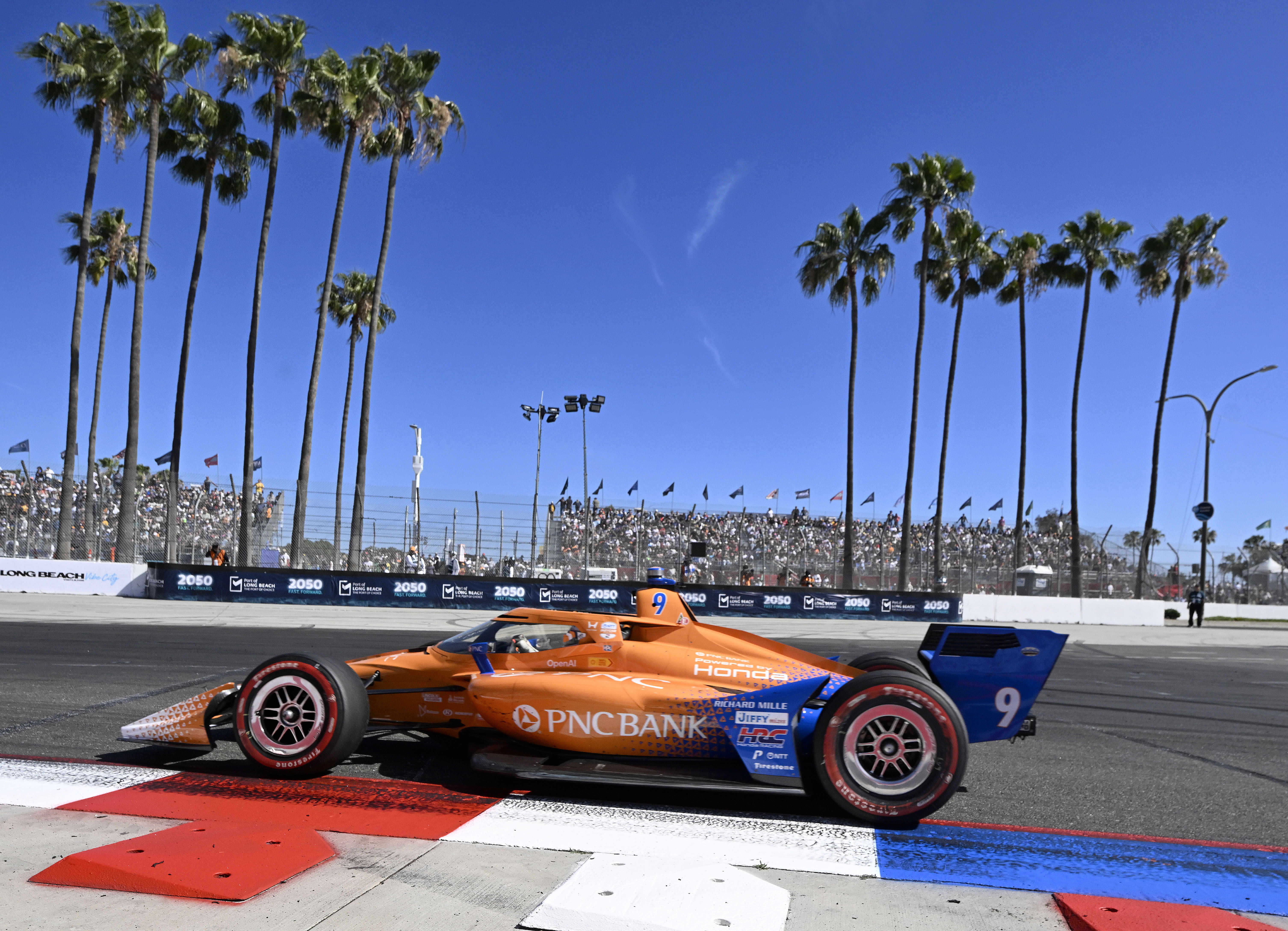 Indycar driver Scott Dixon races towards the hairpin during the...