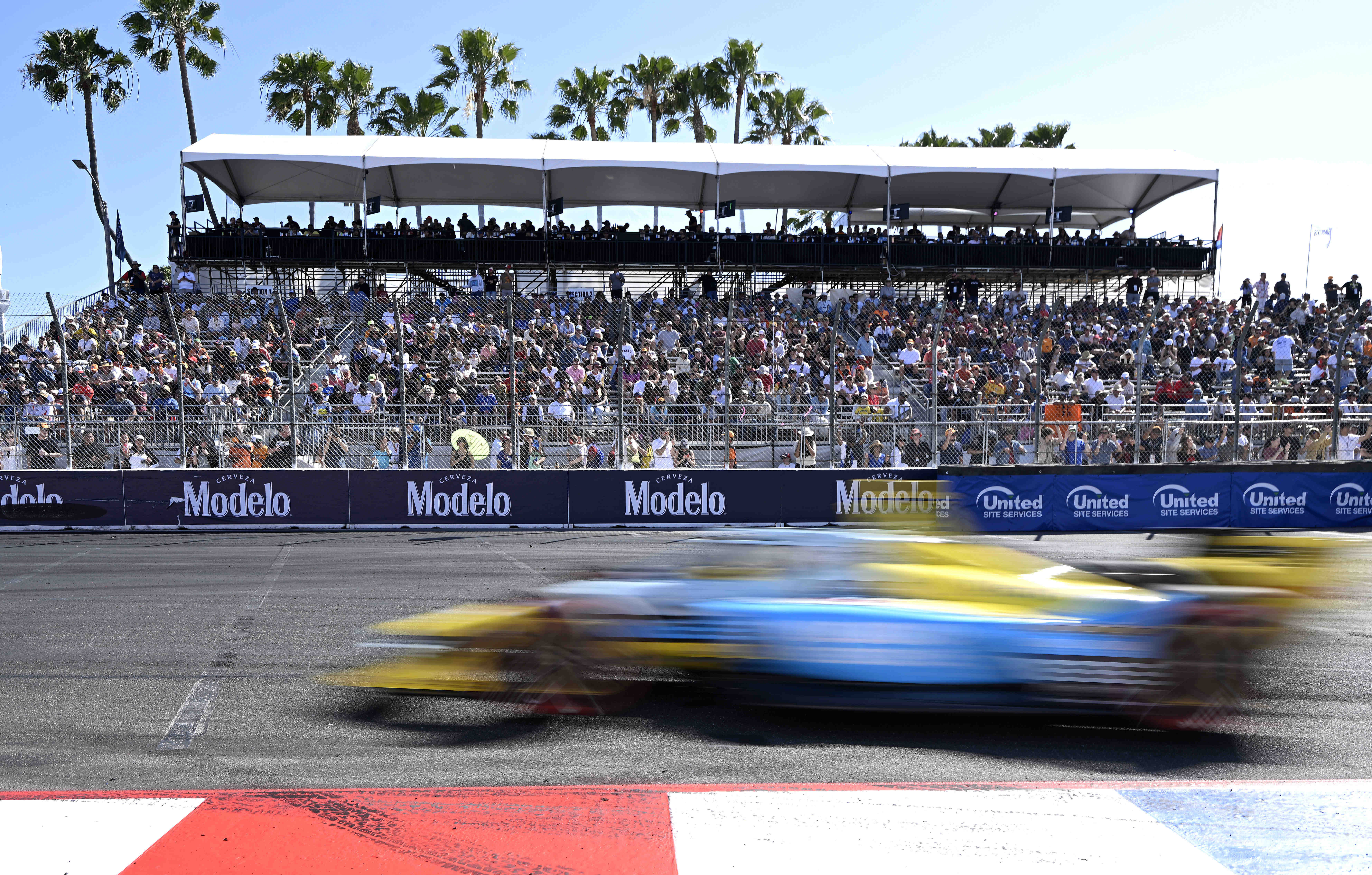 Race fans pack the turn grandstand as Indycar driver Christian...