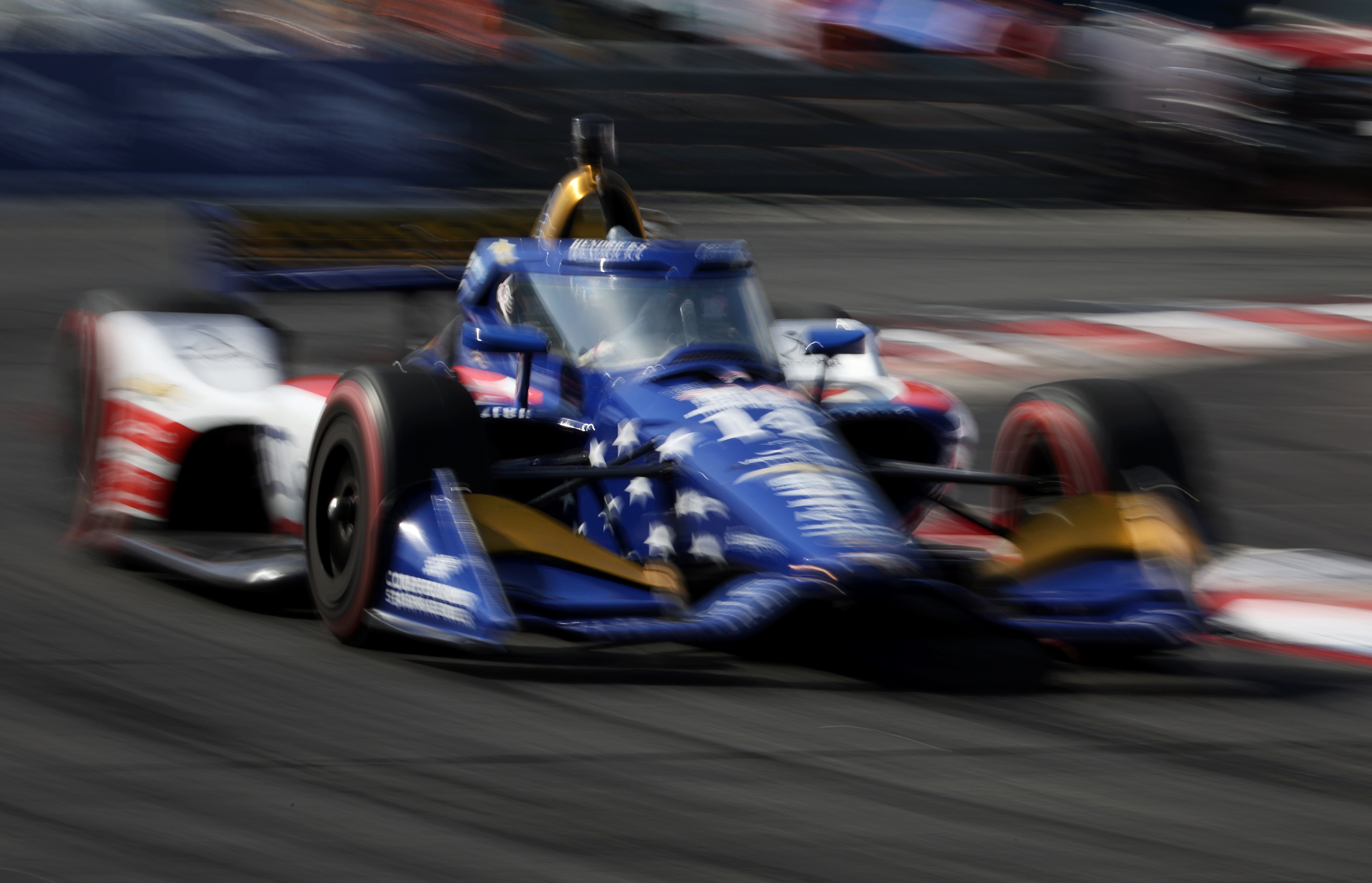 Indycar driver Santino Ferrucci races around turn 10 during the...