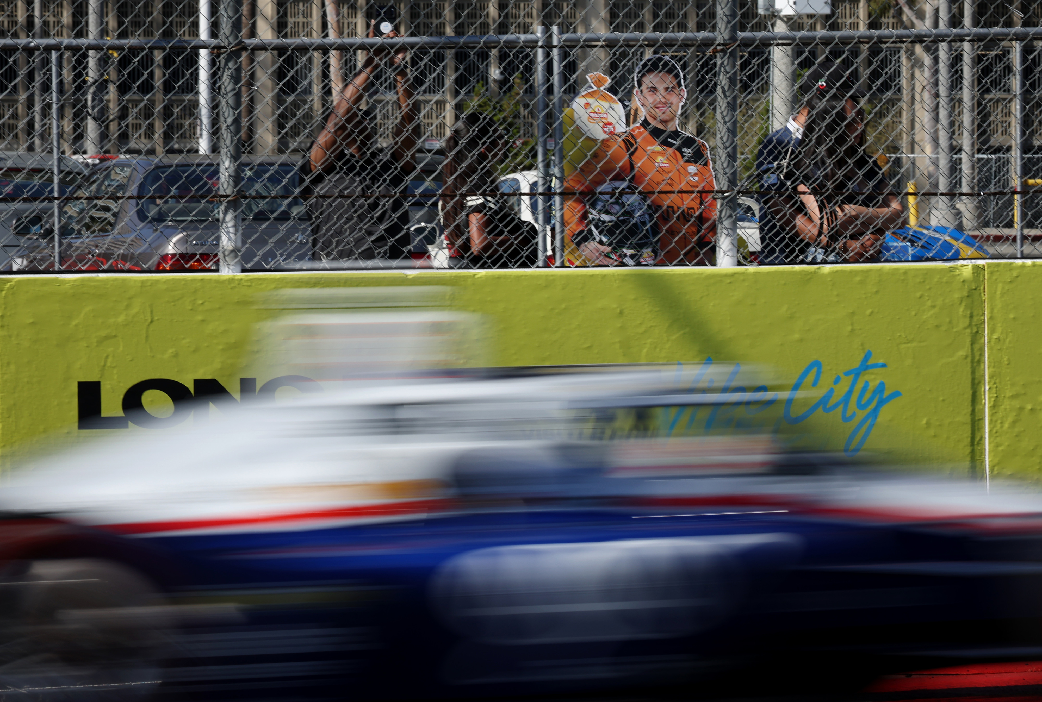 A cutout board of Indycar driver Pato OâWard rests against...