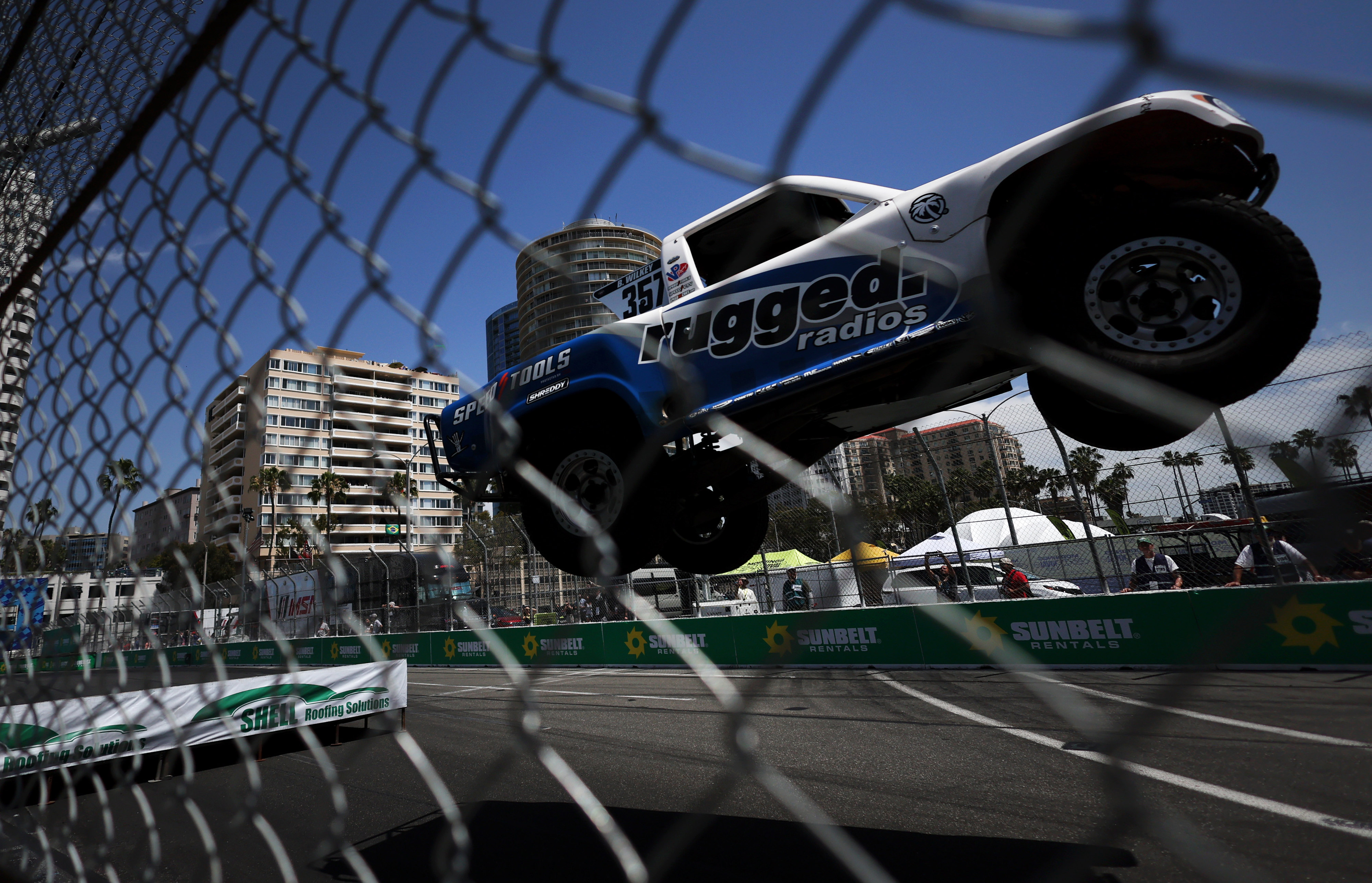 Stadium Super Trucks Blake Wilkey sails through the air in...