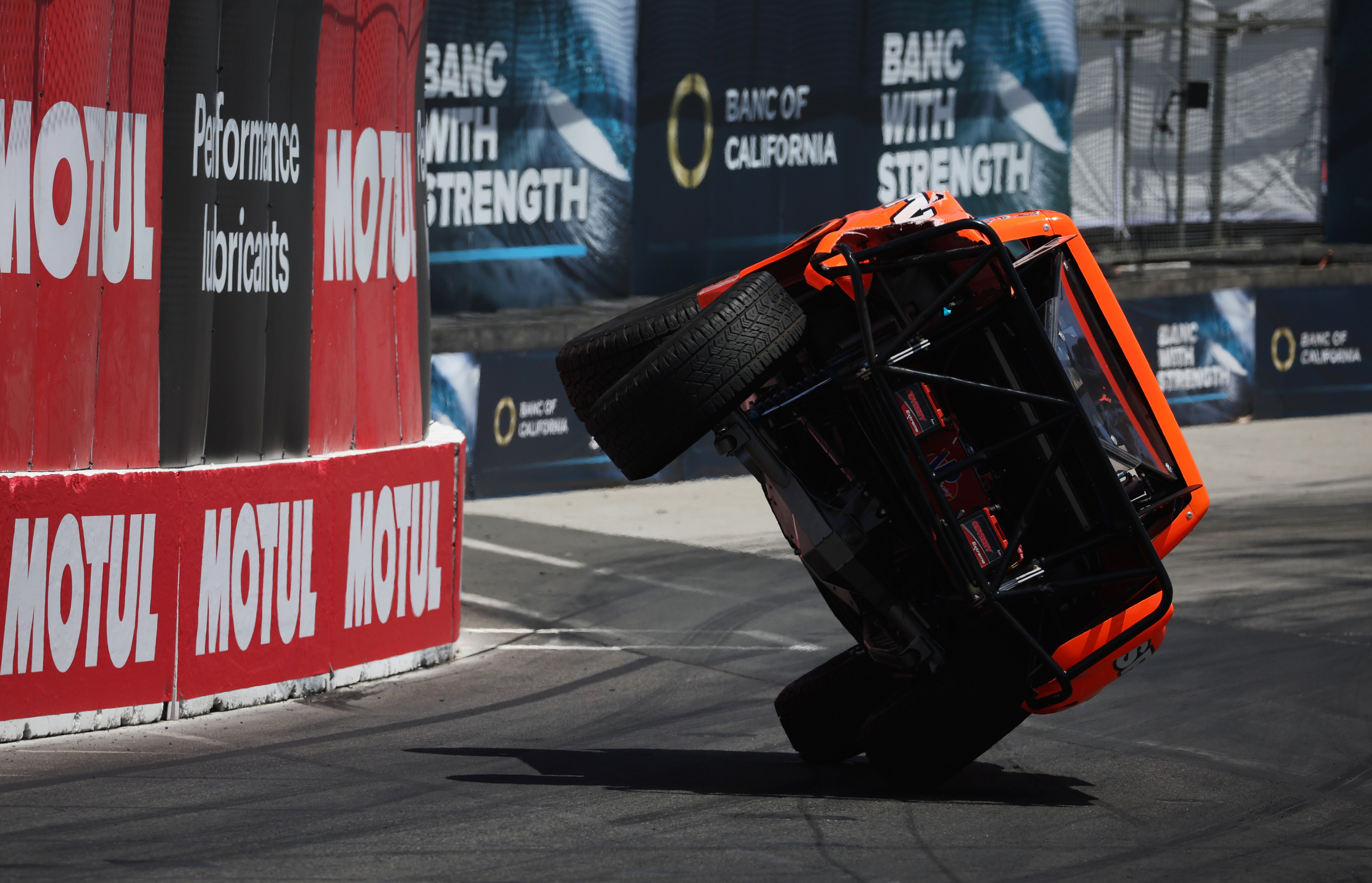 Stadium Super Truck driver Robby Gordon rides on two wheels...