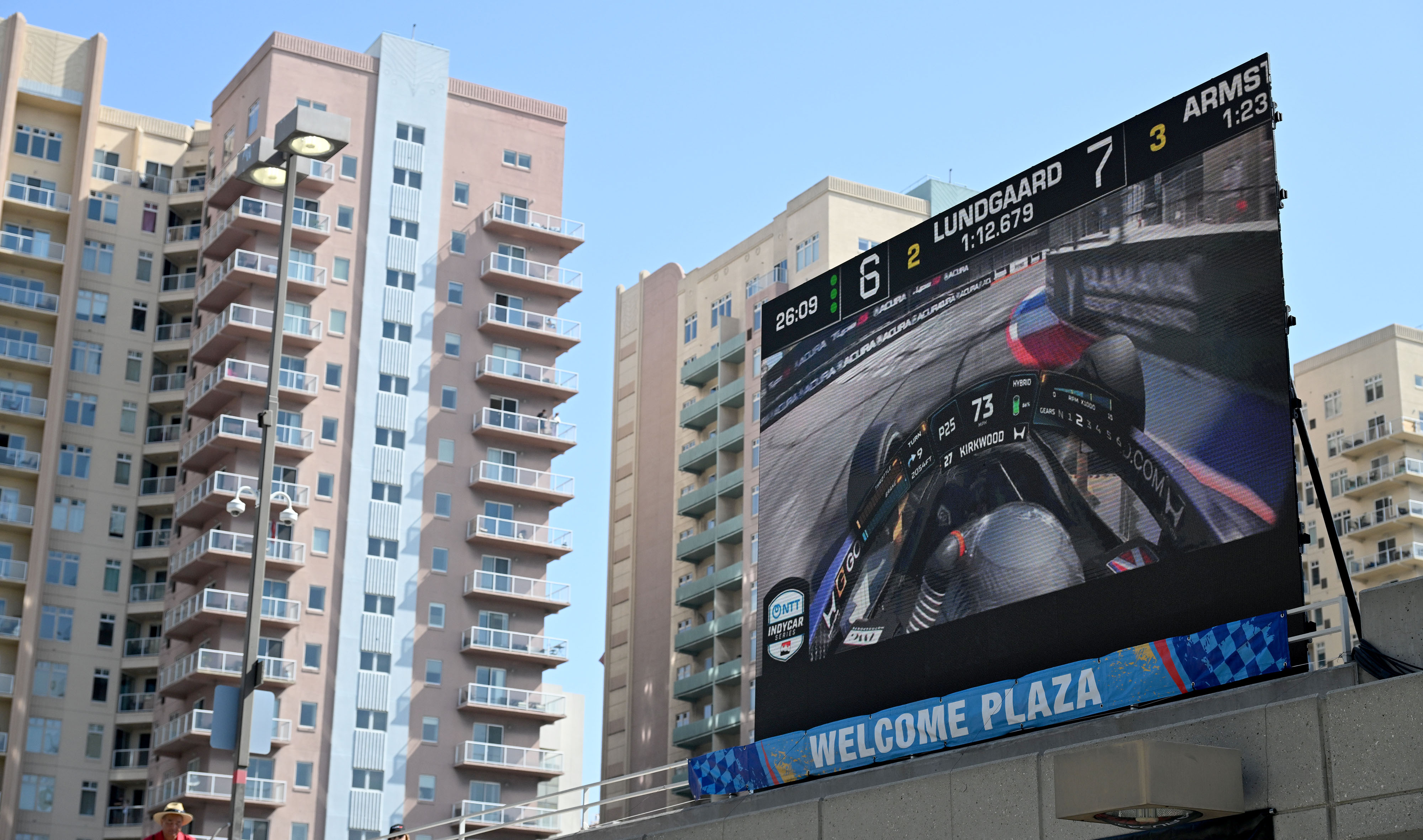 A screen shows live coverage of the races during the...
