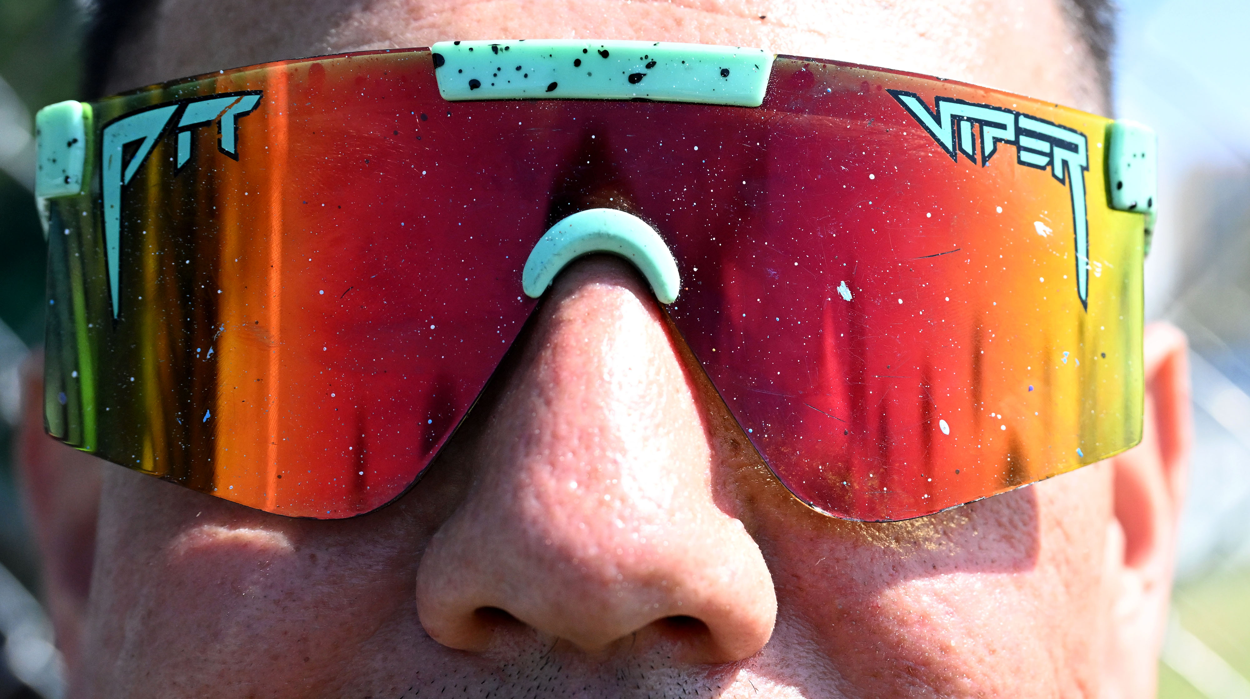 Artist, Jose âDoomsâ Pedroza, wearing his paint speckled sunglasses on...