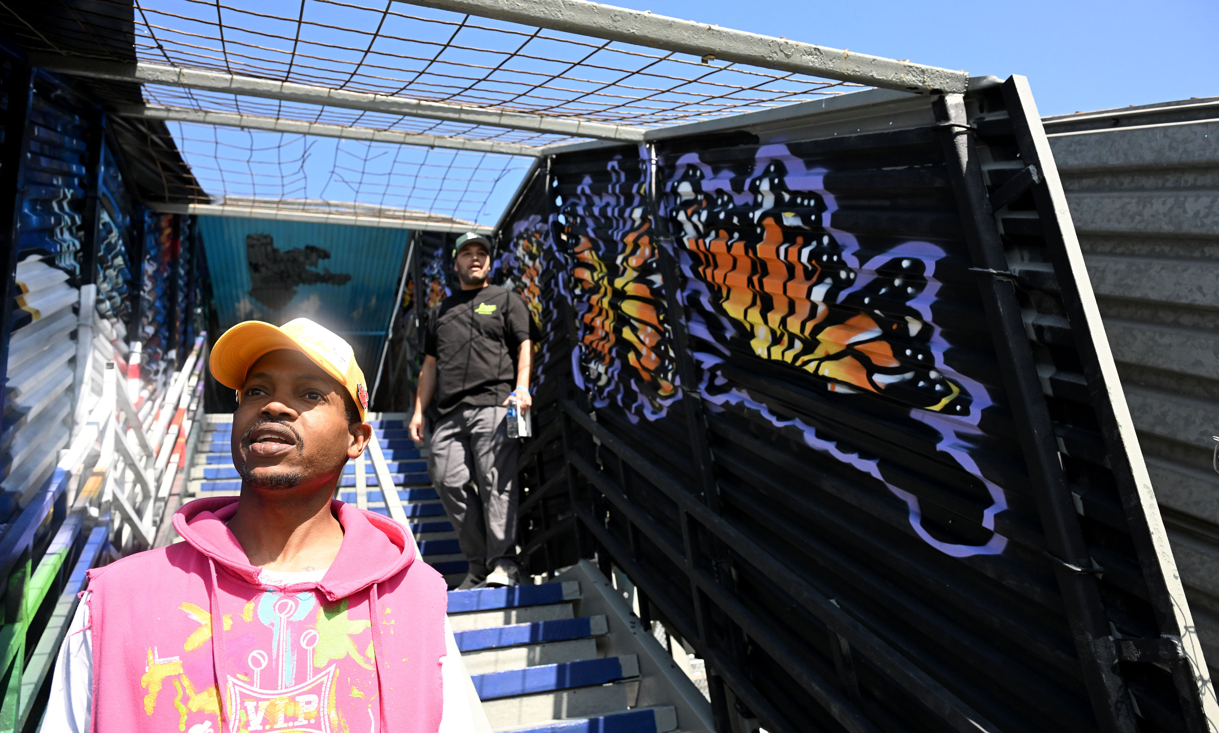 Artists, LaJon Miller, left, who painted the butterflies, and Isidro...
