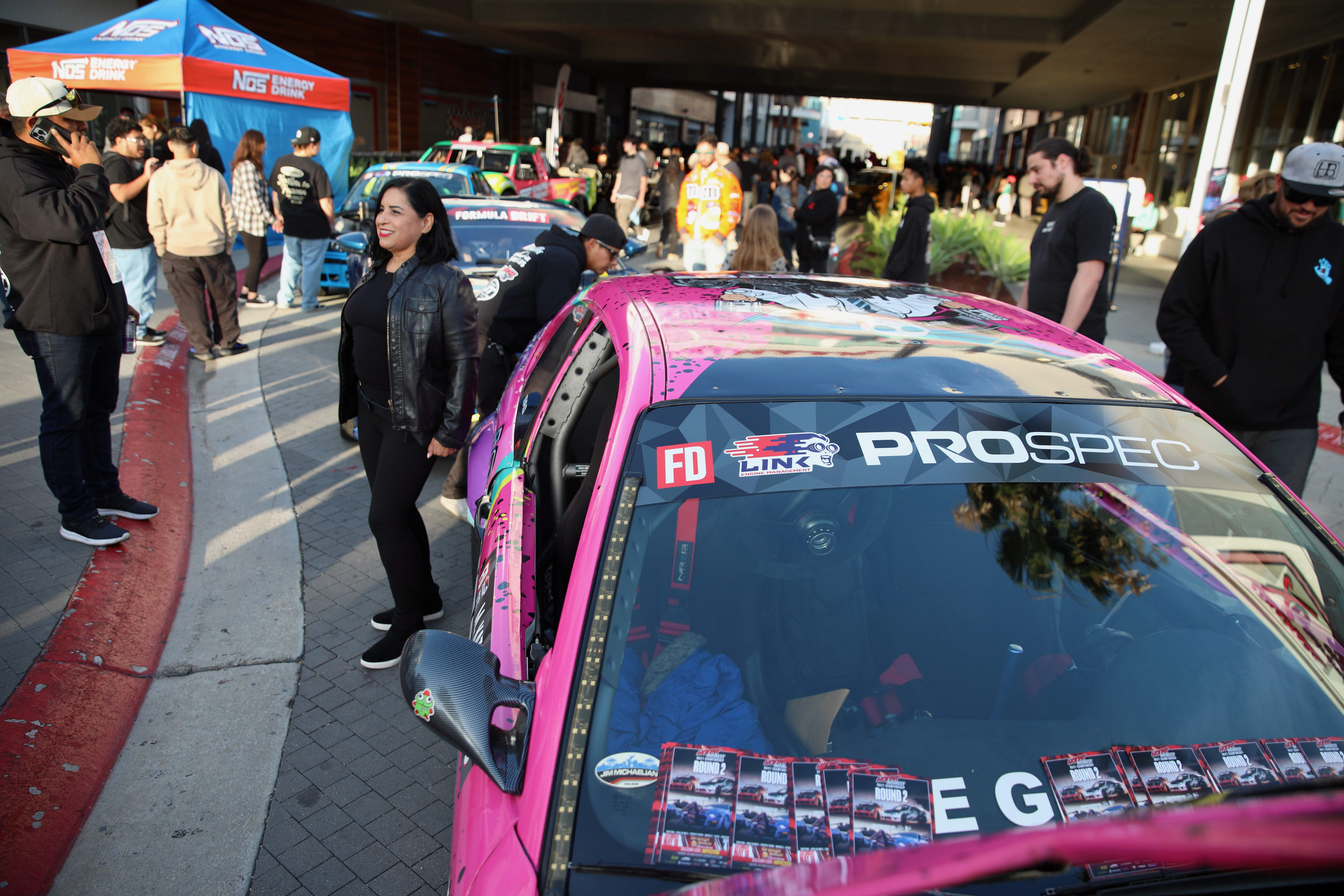 Attendees check out the various racing series cars at Thunder...