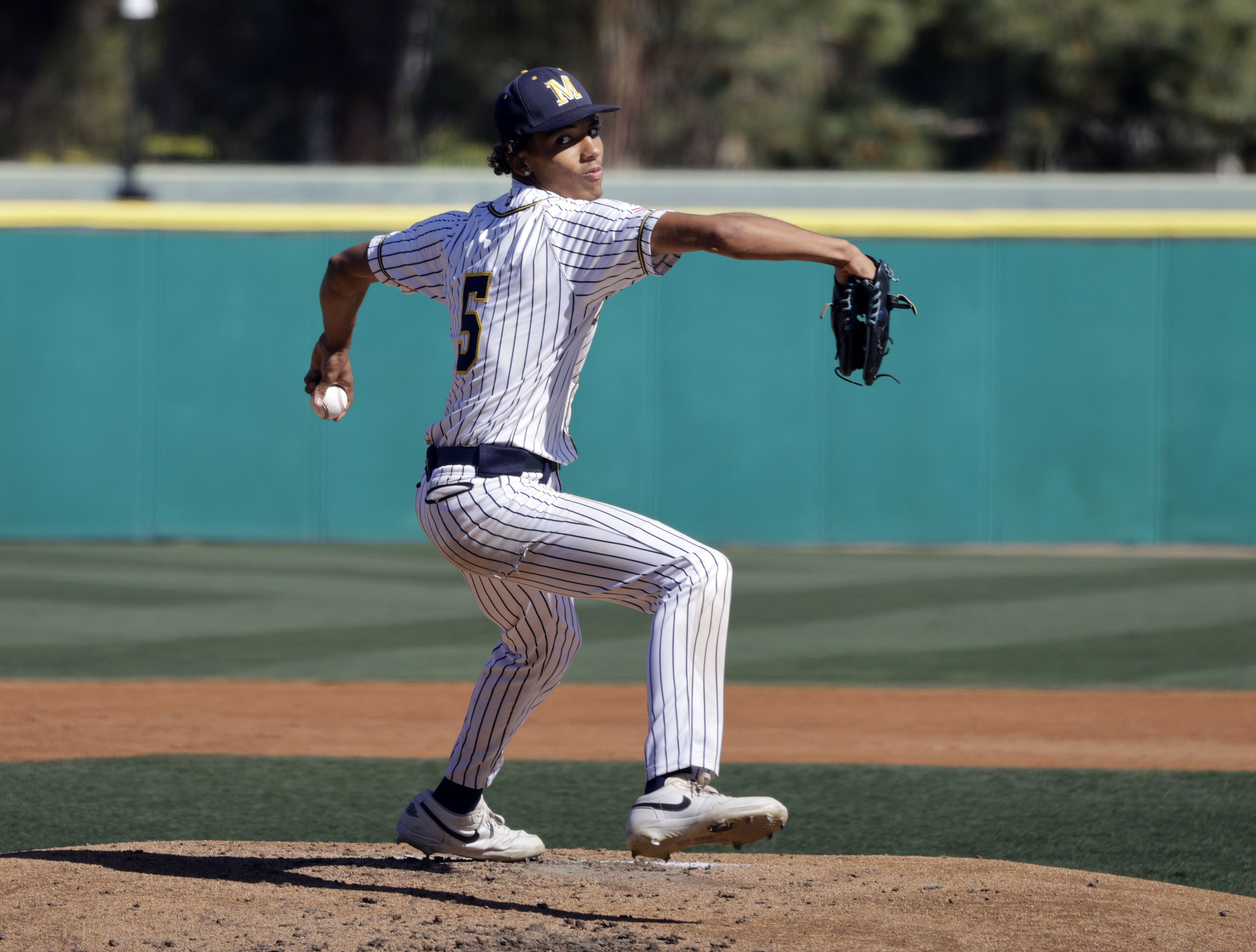 Millikan’s Daunte Bell (5) gets things started for the Rams...