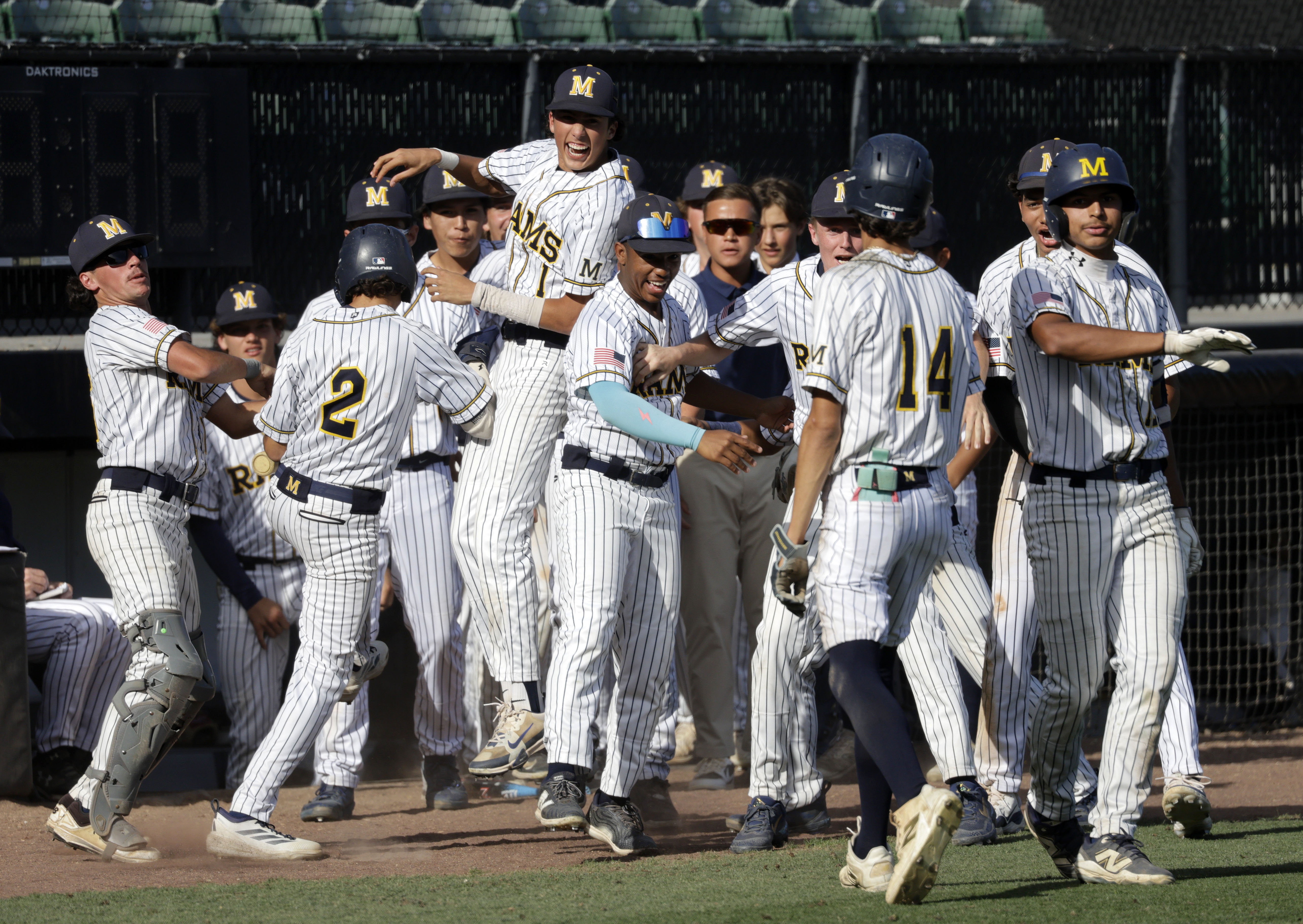 Millikan players celebrate as they take a 4-0 lead over...