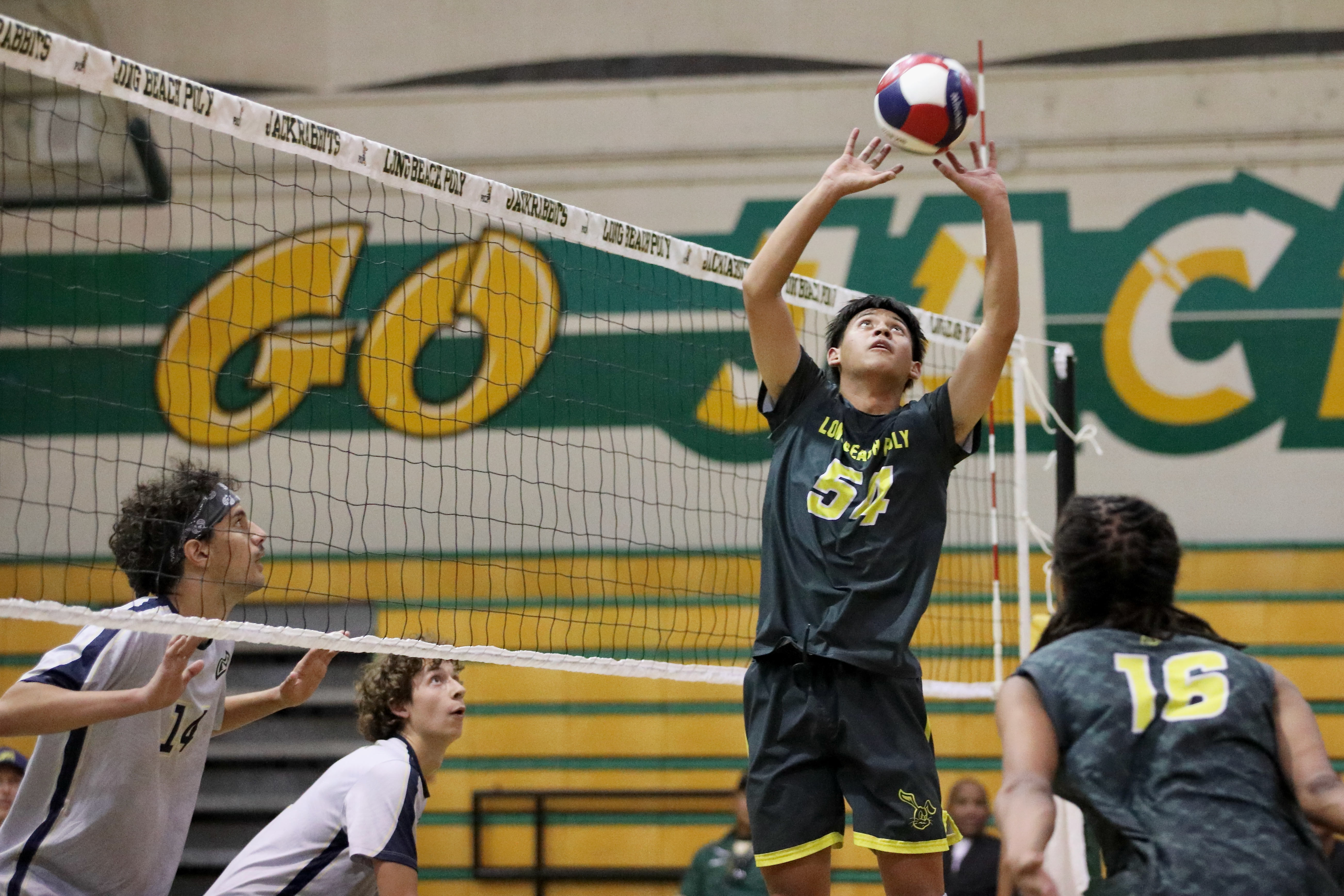 Long Beach Poly setter Josiah Walton readies to pass against...