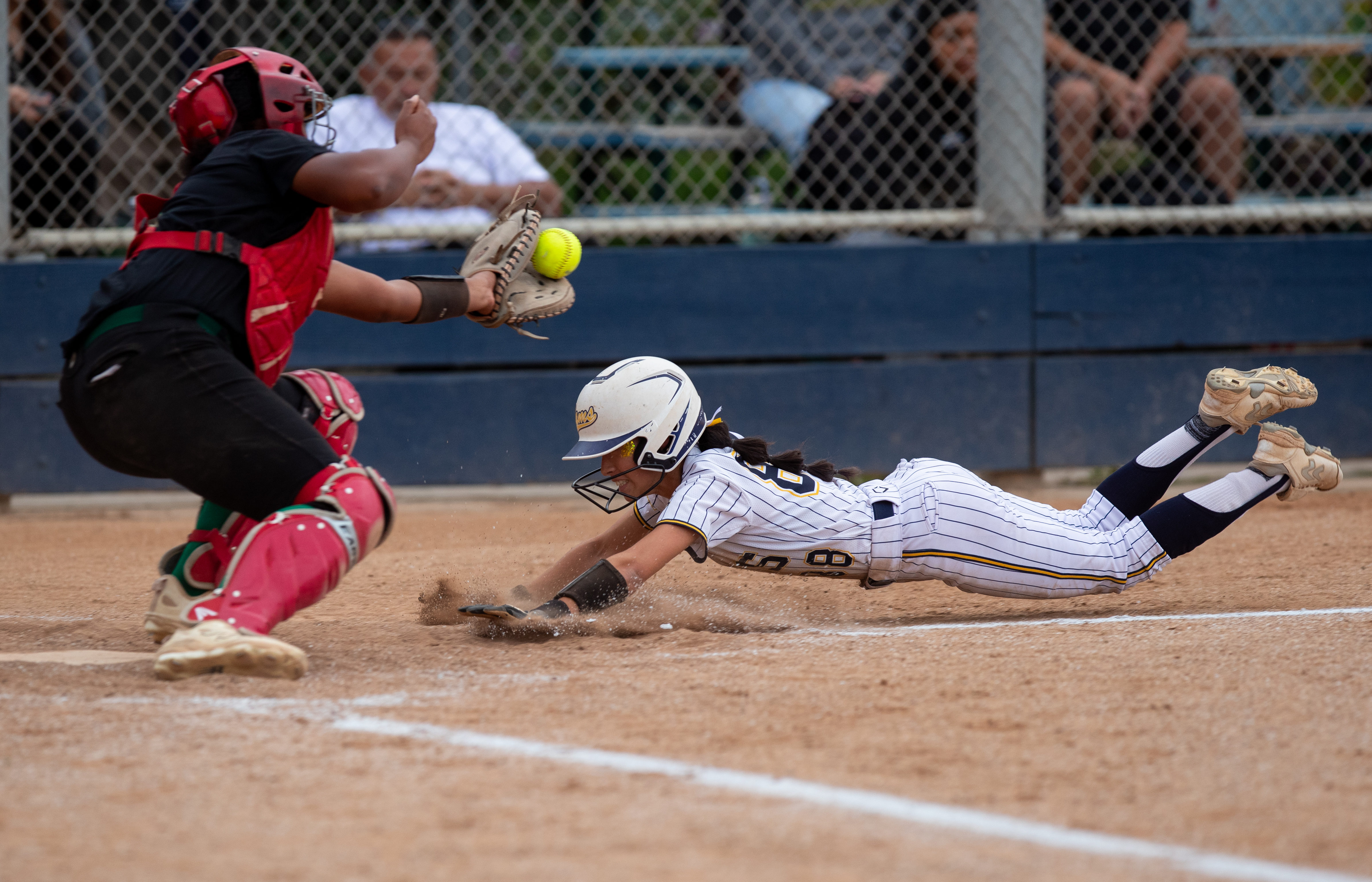 Millikanâs Mia Meza slides underneath the tag from Long Beach...