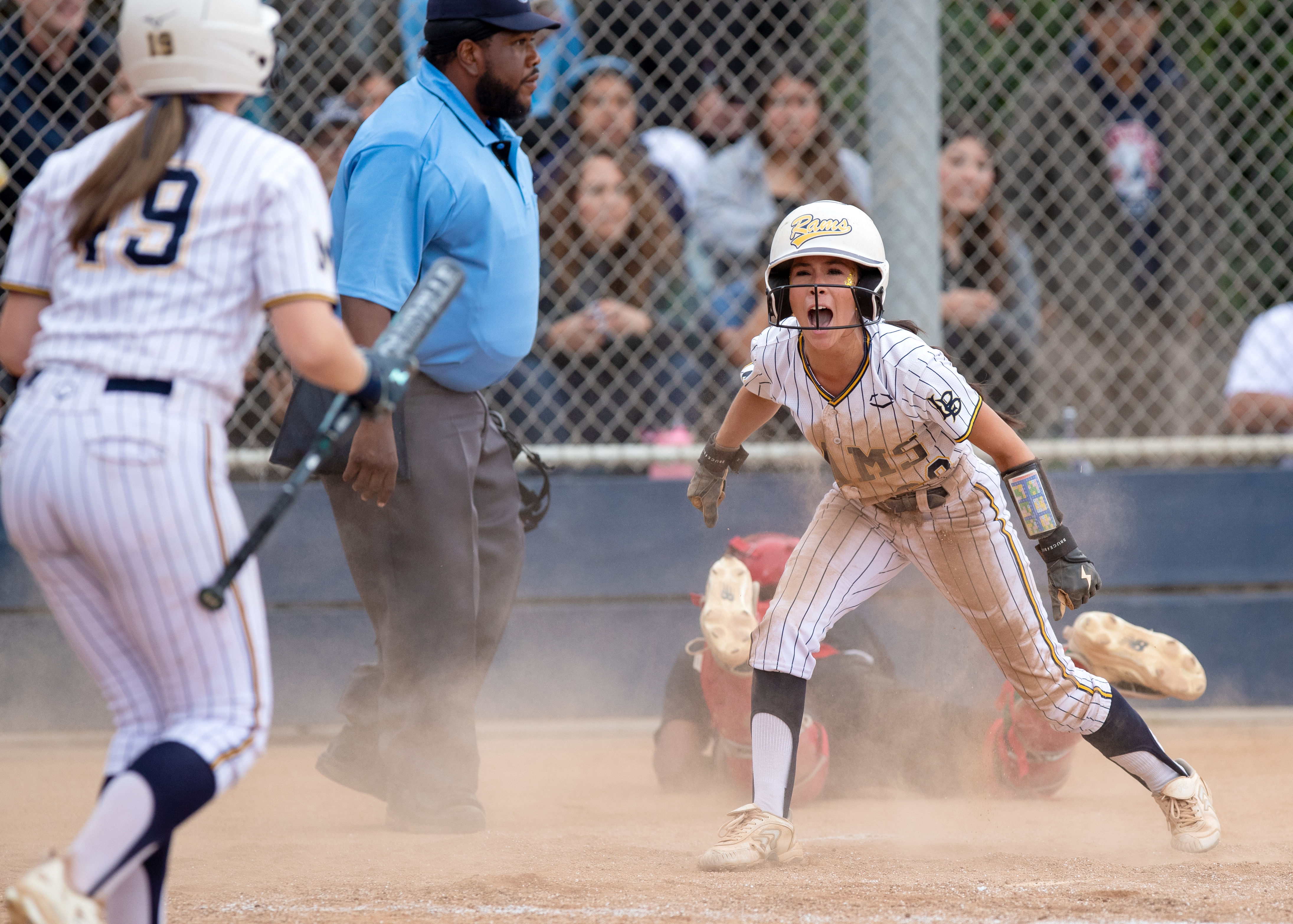Millikanâs Mia Meza reacts after scoring a run in the...