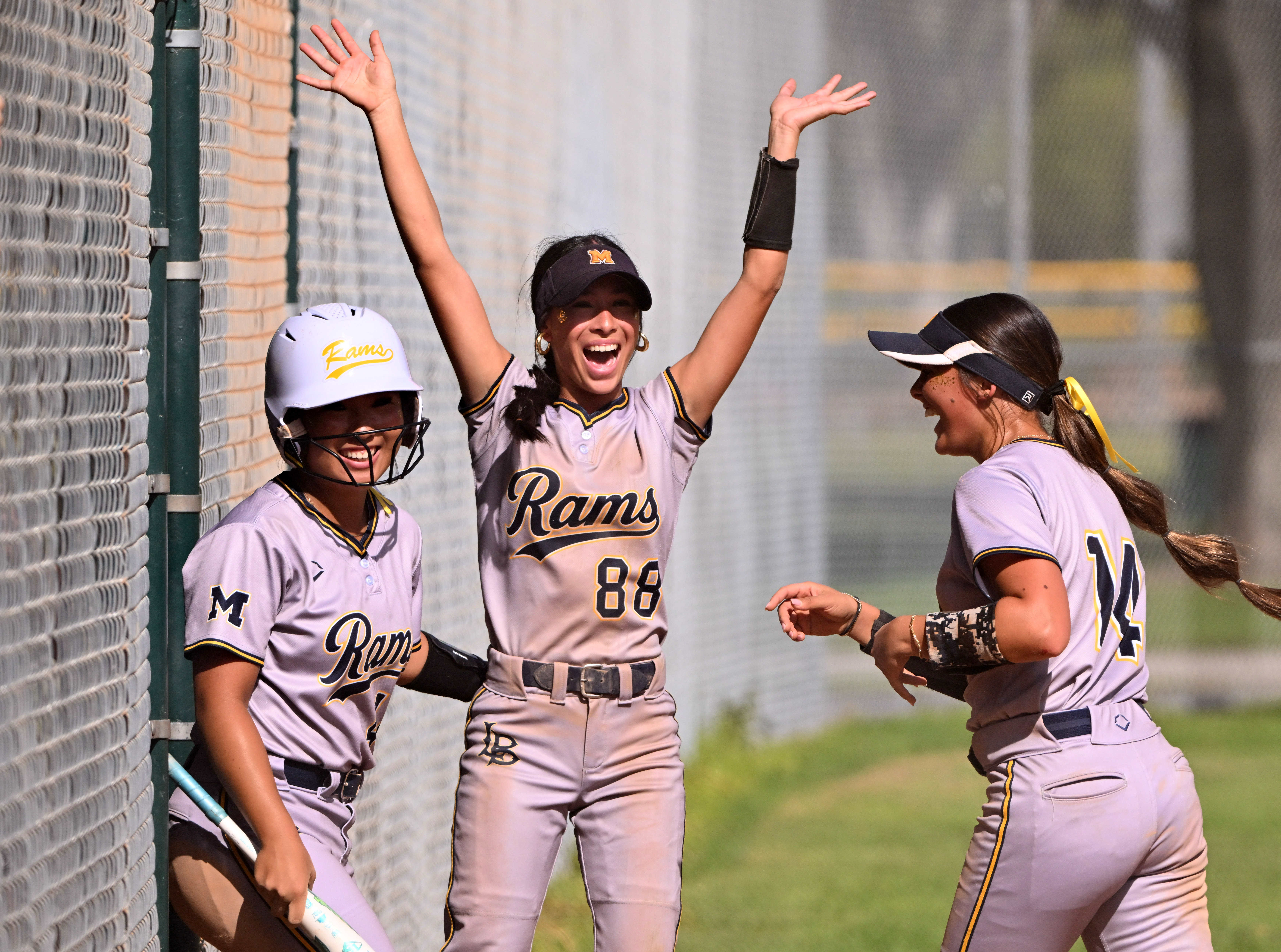 Mia Meza #88 of the Millikan Rams reacts along with...