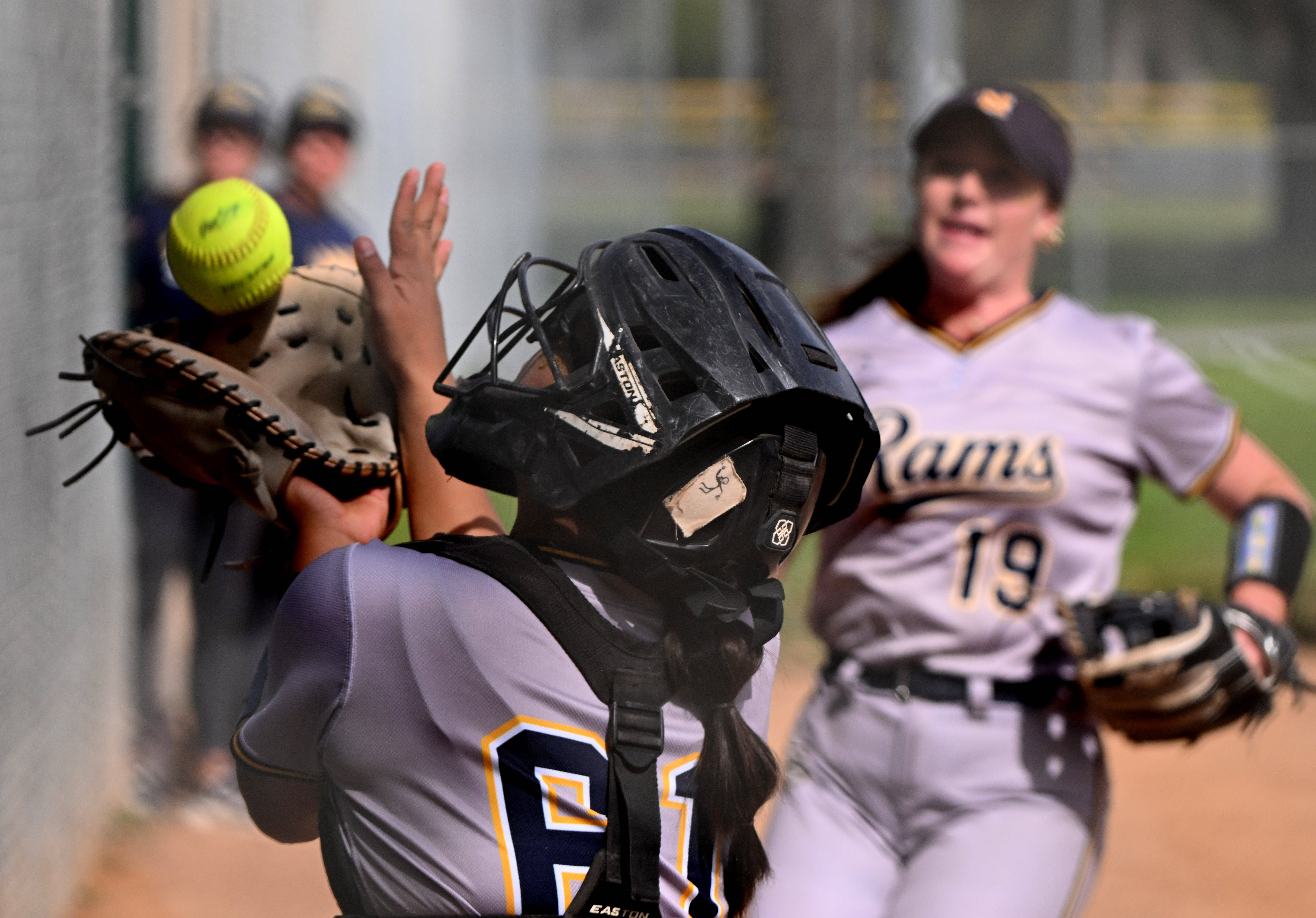 Catcher Maya Hernandez #61 of the Millikan Rams catches a...