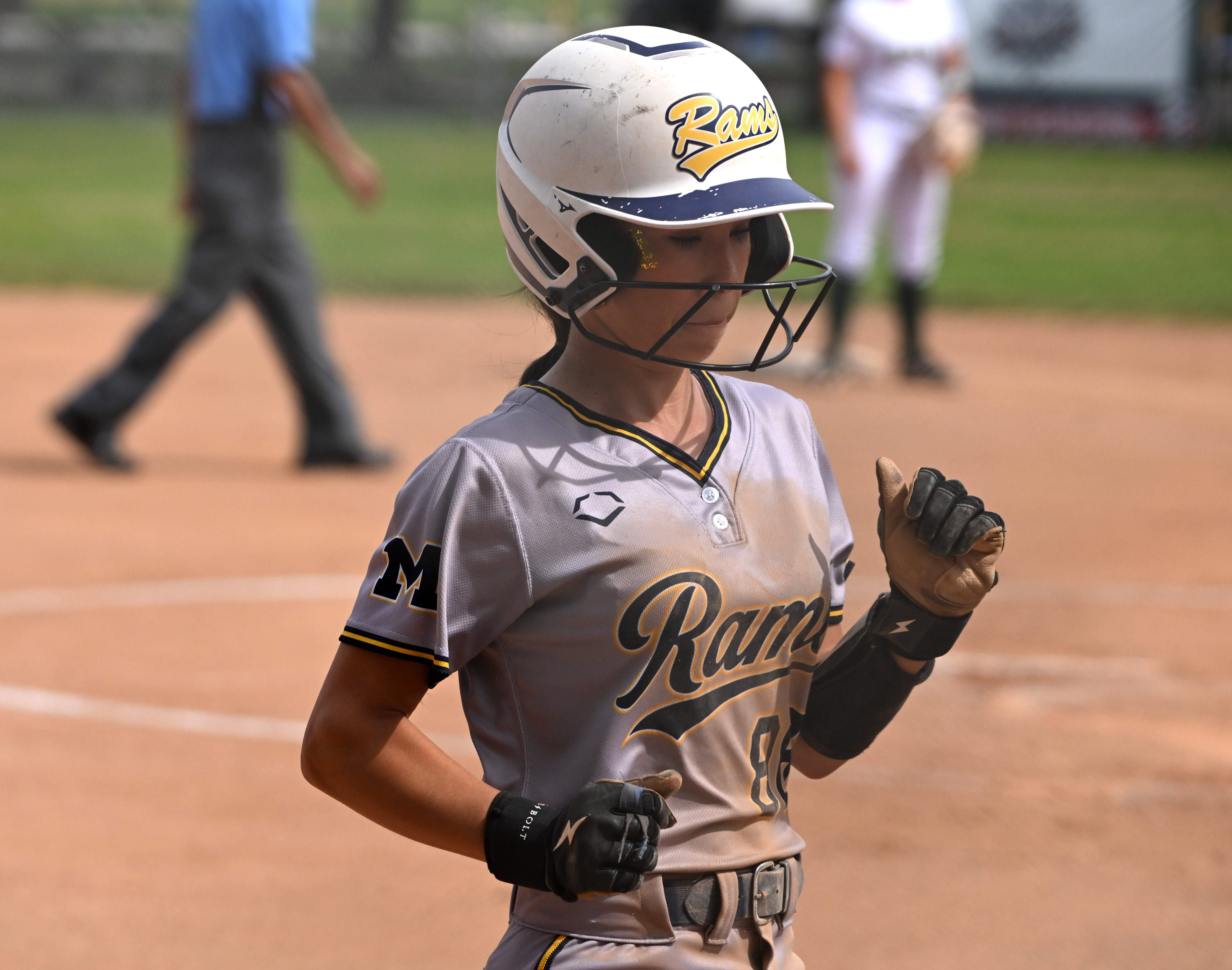 Mia Meza #88 scores on a sac fly by teammate...