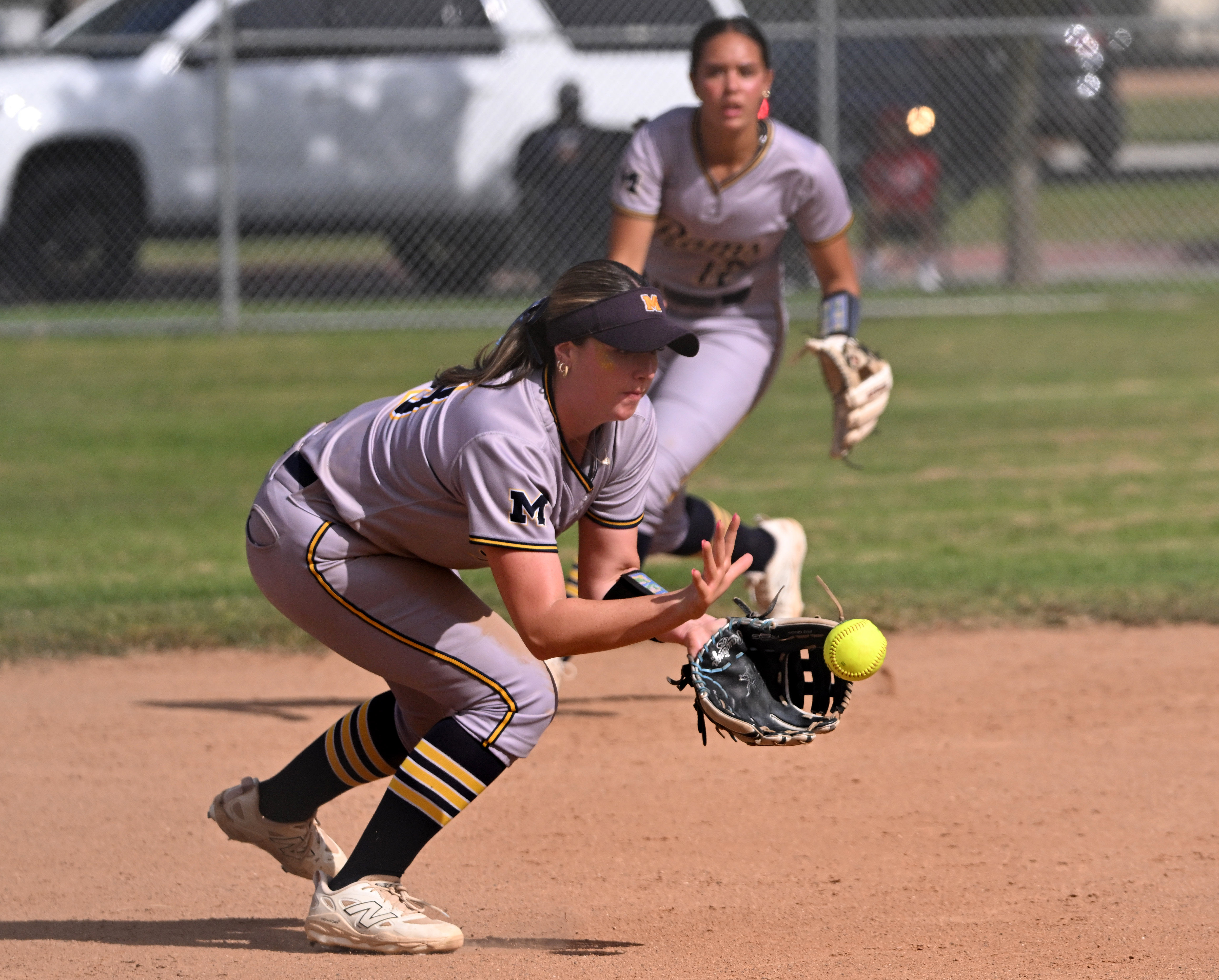 Third baseman Addy Everrett #19 of the Millikan Rams fields...