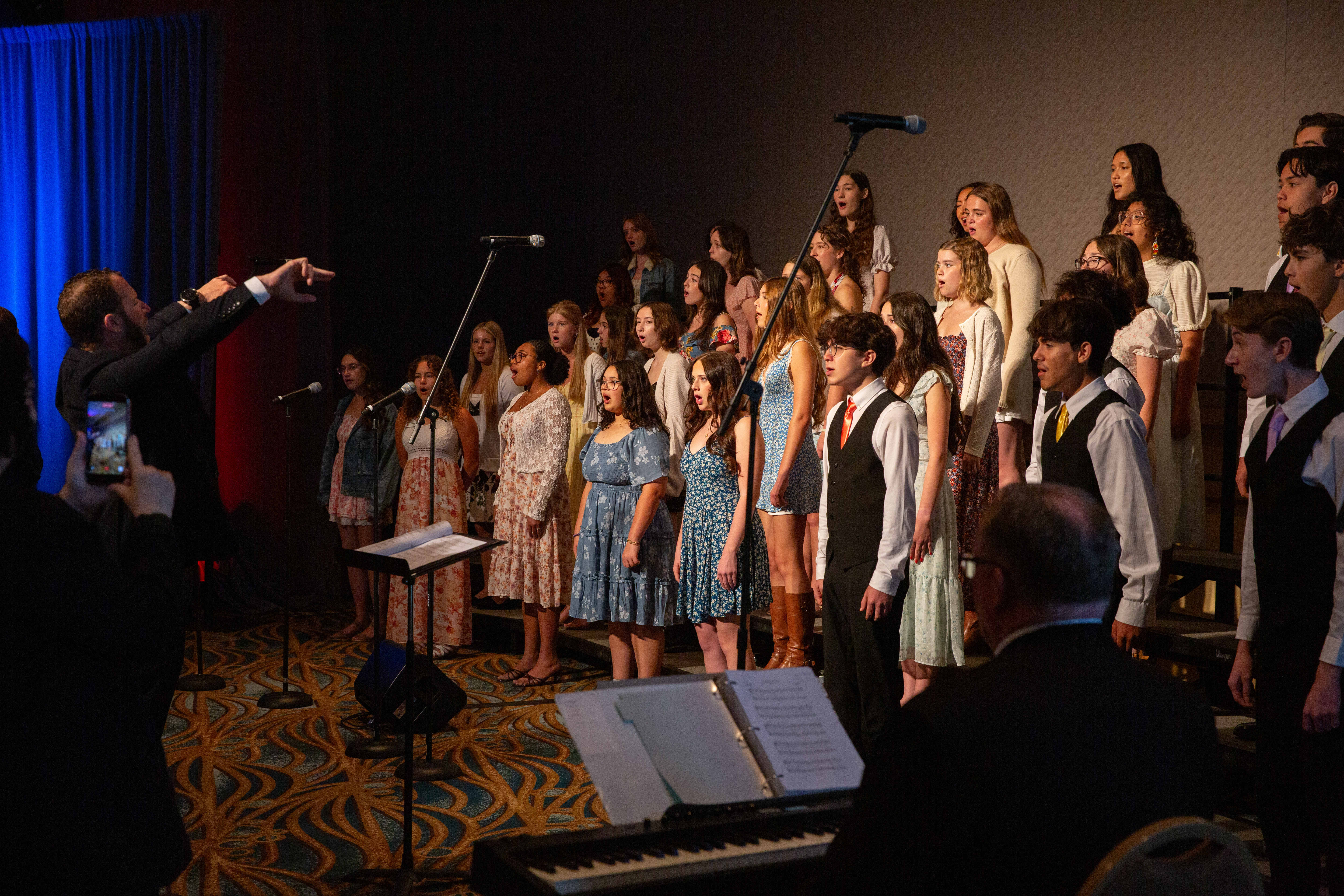 Members of the Millikan High School Chamber Choir sing various...