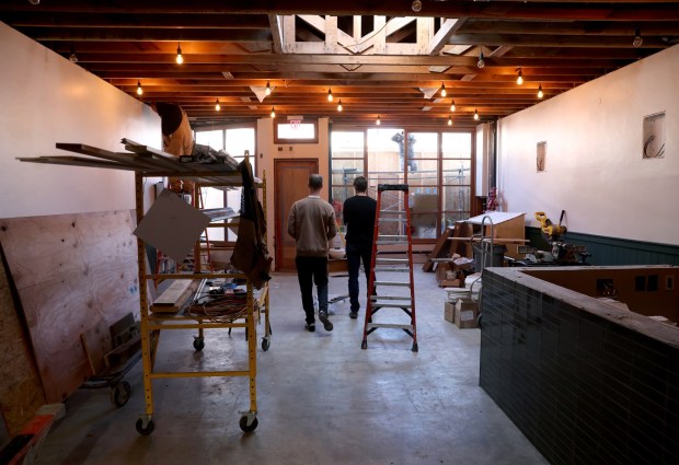 Two Pitchers Brewing Company co-owners Tommy Hester and Wilson Barr, from left, walk through their new location as remodeling continues on Noriega Street in San Francisco, Calif., on Tuesday, Feb. 3, 2026. Their original location is on Webster Street in downtown Oakland. (Jane Tyska/Bay Area News Group)